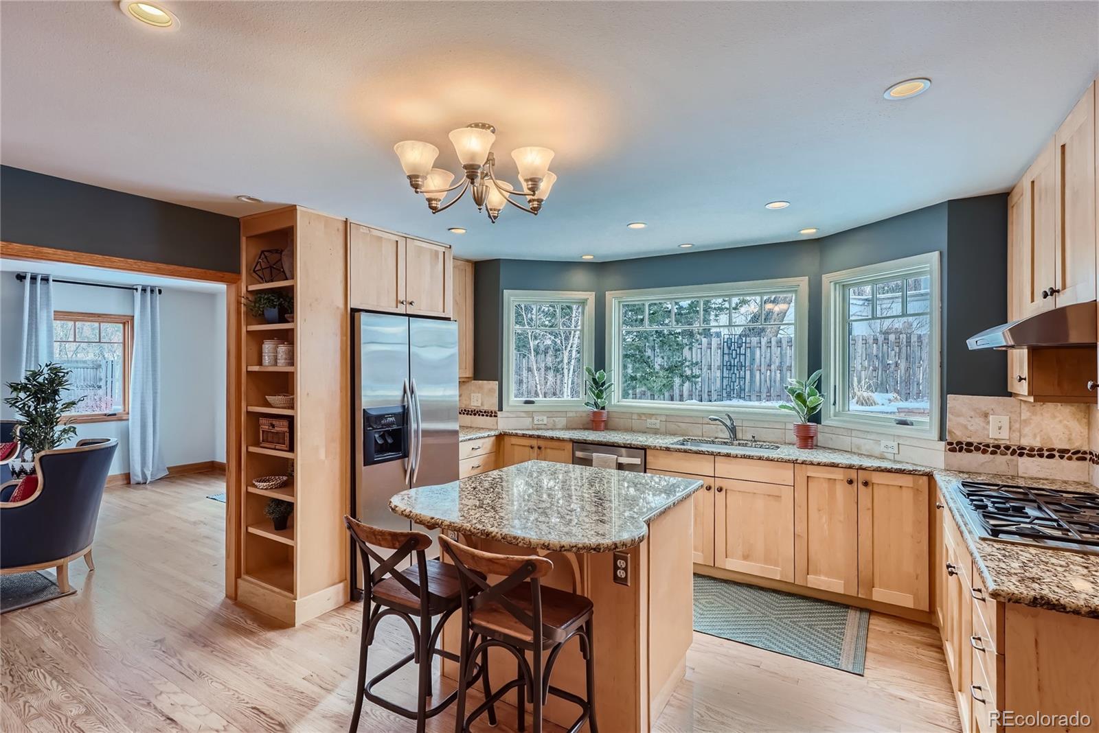 205 Fair Place Boulder, CO 80302 - Photo 11 of 46 a large kitchen with a table and chairs in it