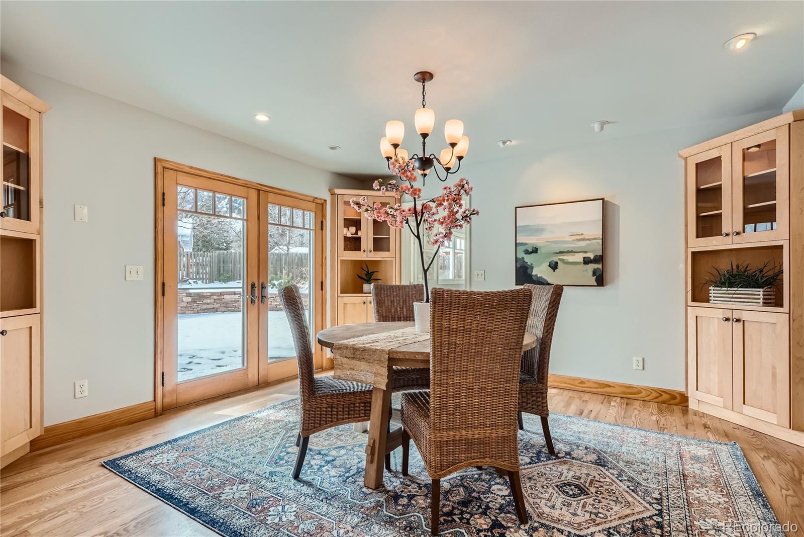 205 Fair Place Boulder, CO 80302 - Photo 15 of 46 a dining room with furniture a rug a potted plant and a chandelier