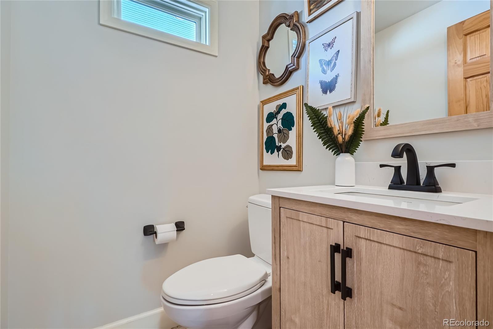 205 Fair Place Boulder, CO 80302 - Photo 17 of 46 a bathroom with a toilet sink and mirror