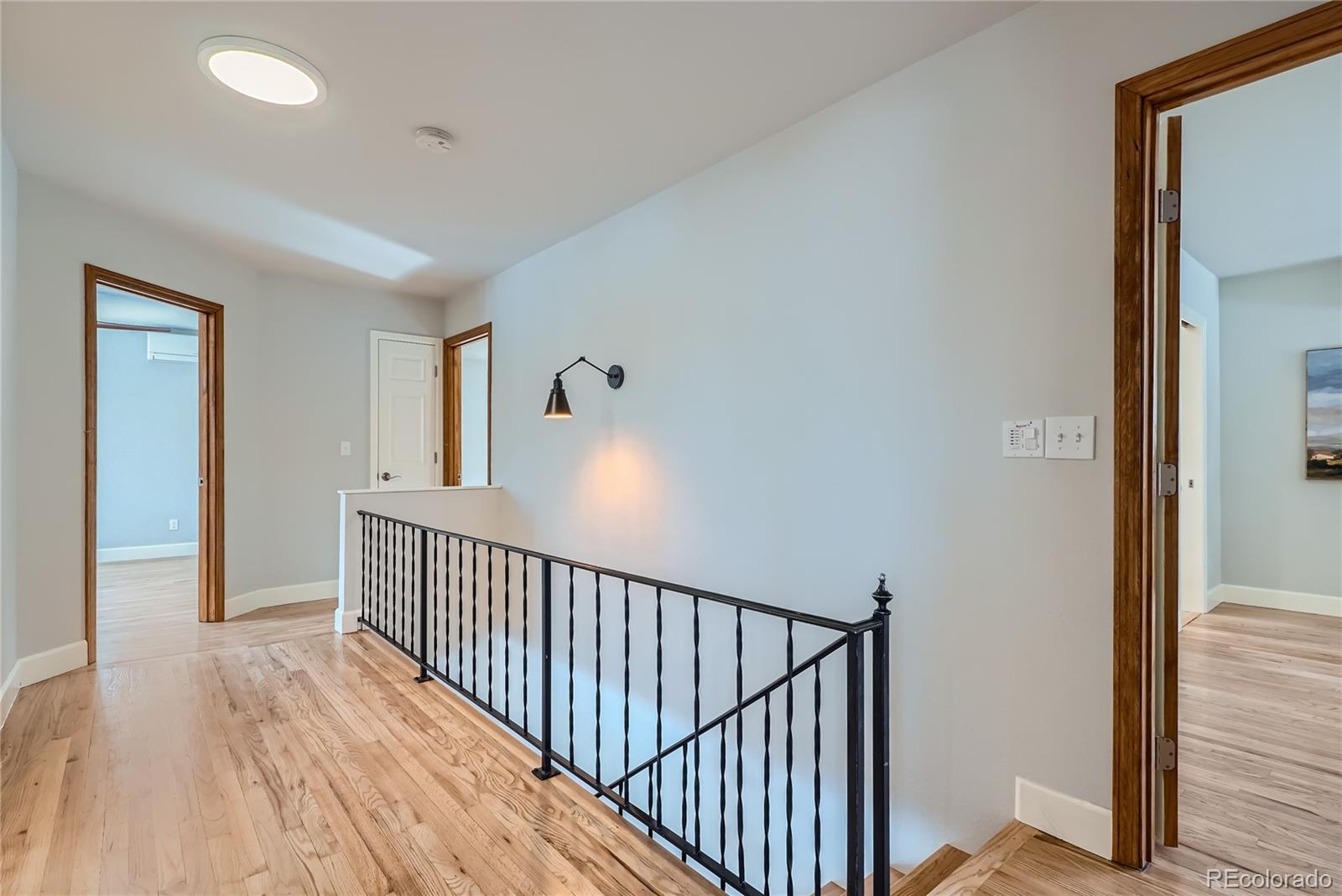 205 Fair Place Boulder, CO 80302 - Photo 19 of 46 a view of a hallway with wooden floor and stairs