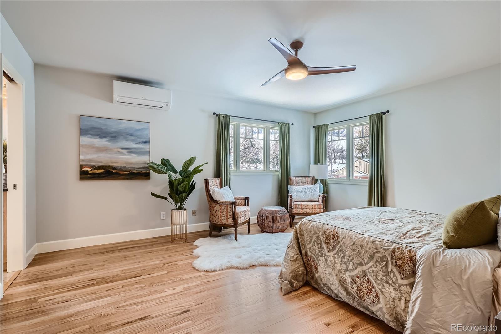 205 Fair Place Boulder, CO 80302 - Photo 20 of 46 a bedroom with a large bed and wooden floor