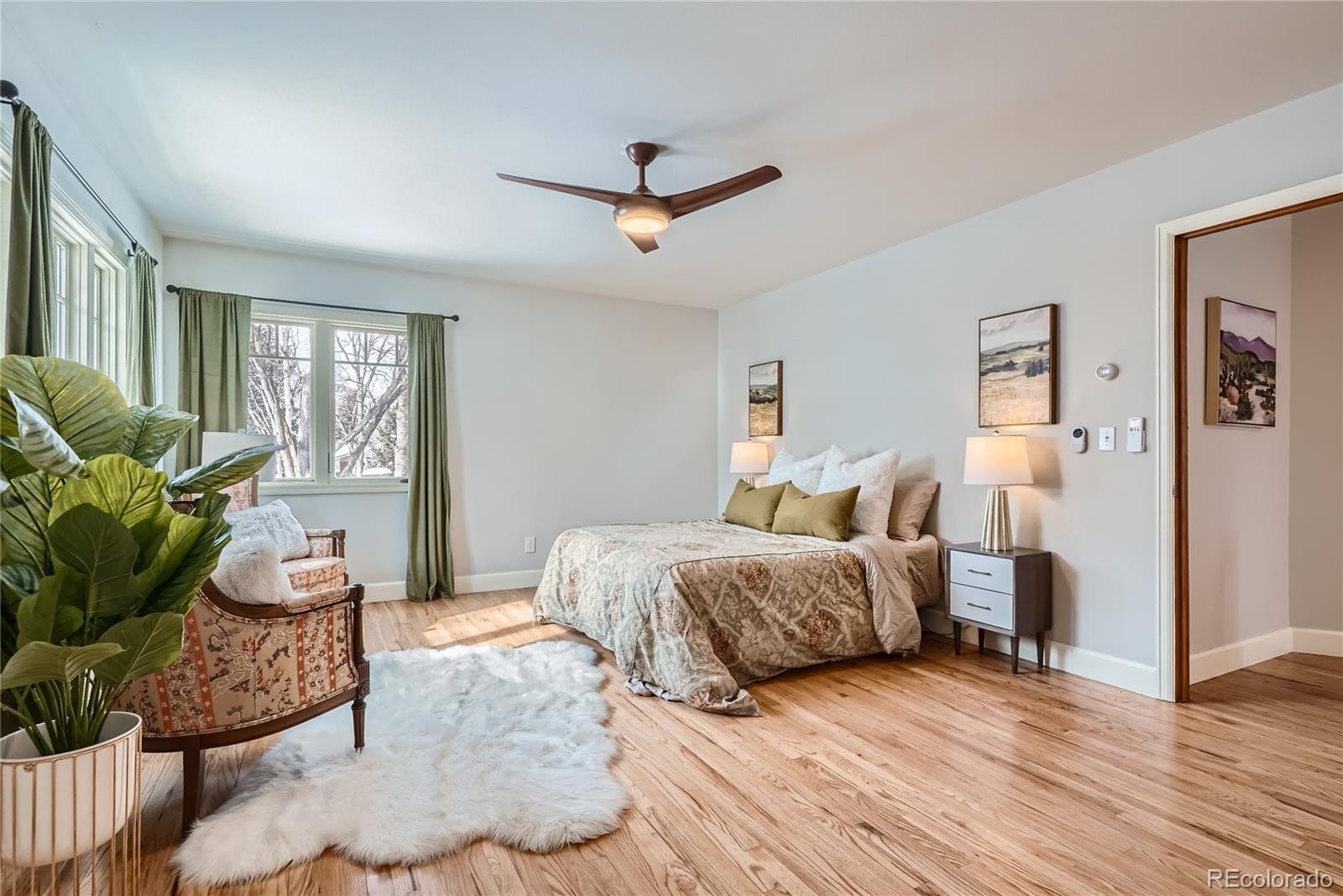 205 Fair Place Boulder, CO 80302 - Photo 21 of 46 a spacious bedroom with a bed and wooden floor