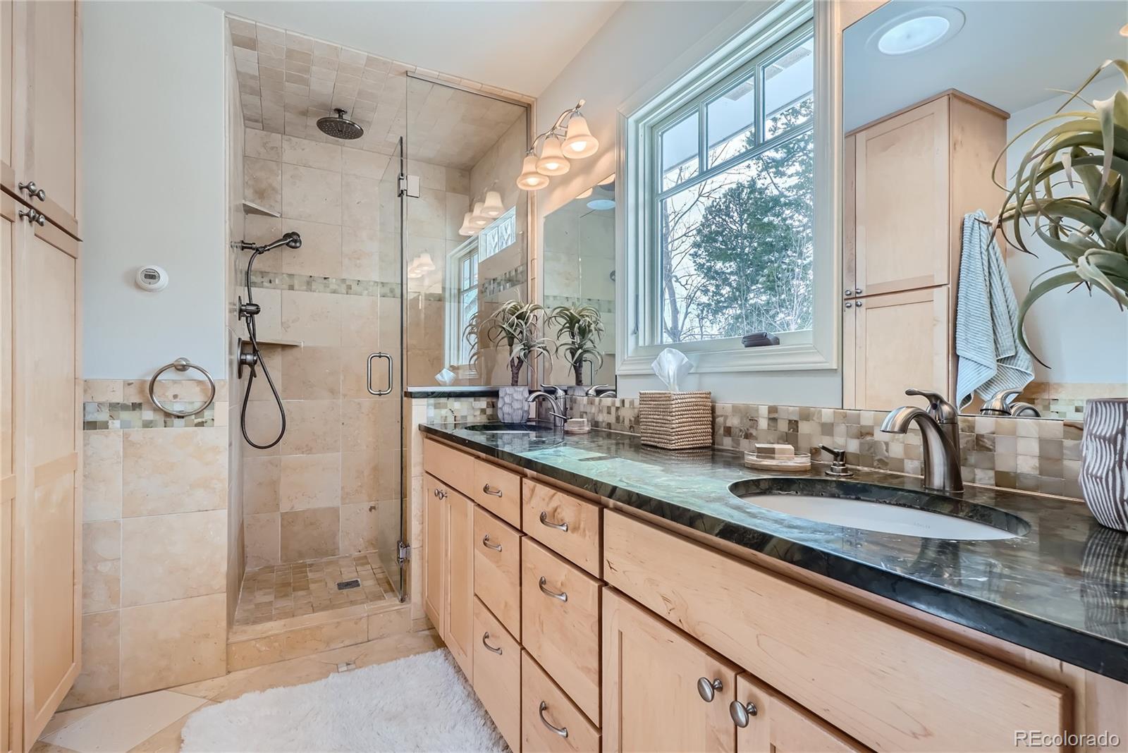 205 Fair Place Boulder, CO 80302 - Photo 22 of 46 a bathroom with double vanity sink and mirror