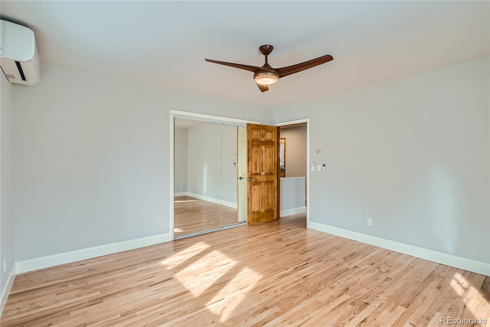 205 Fair Place Boulder, CO 80302 - Photo 26 of 46 a view of empty room with wooden floor and fan