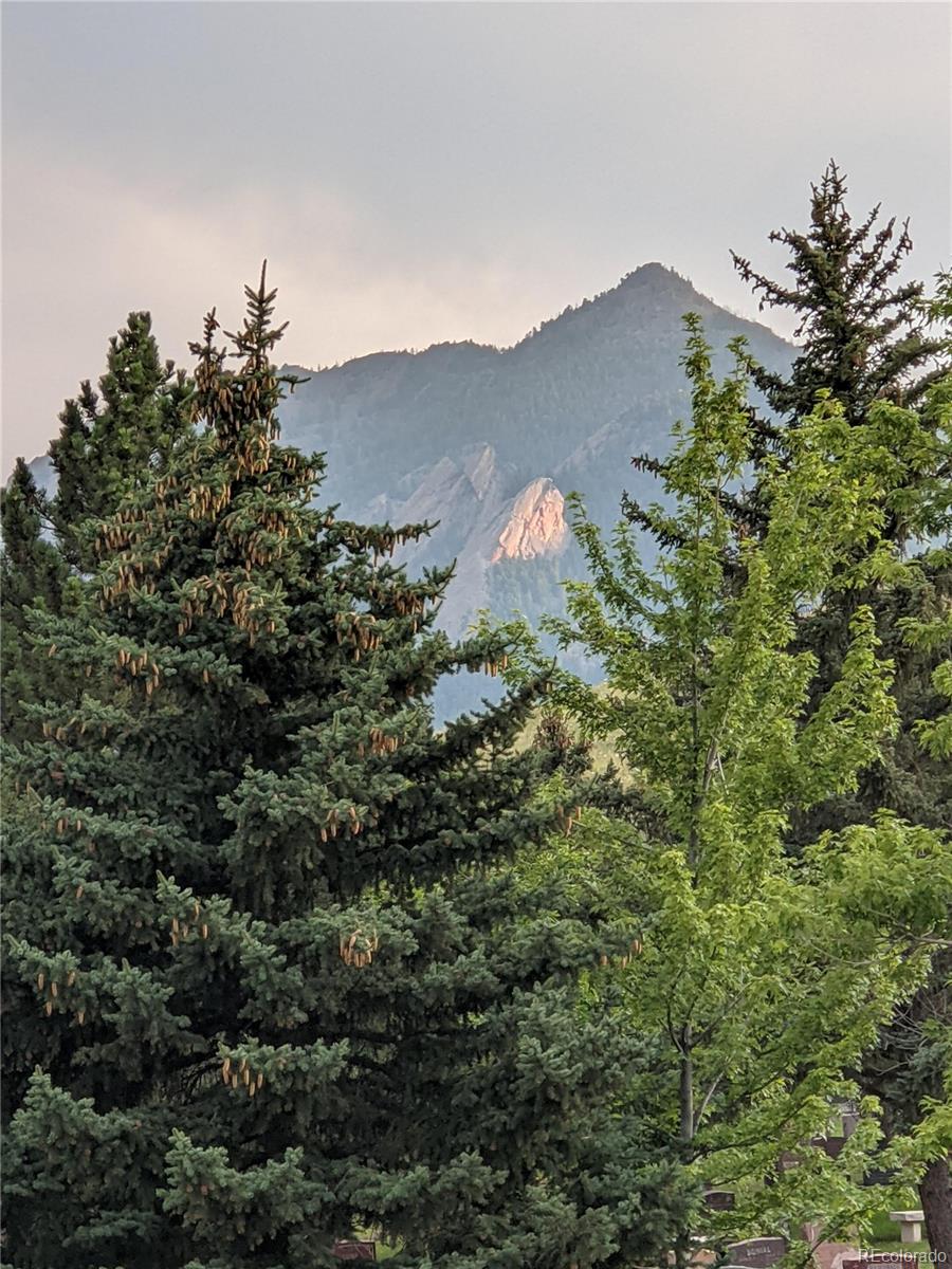 205 Fair Place Boulder, CO 80302 - Photo 34 of 46 a view of a house with a mountain and a forest
