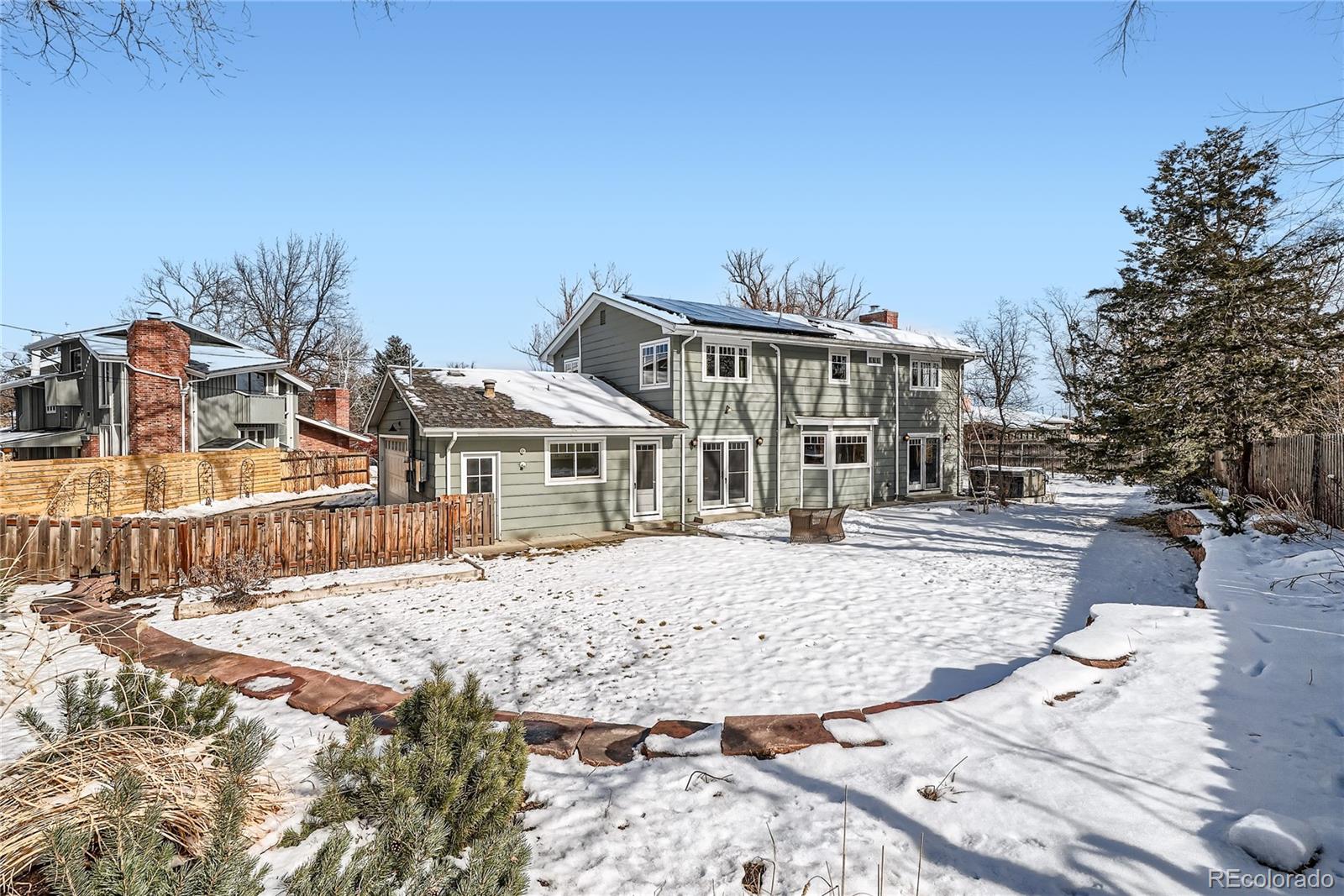 205 Fair Place Boulder, CO 80302 - Photo 37 of 46 a view of a house with snow on the background