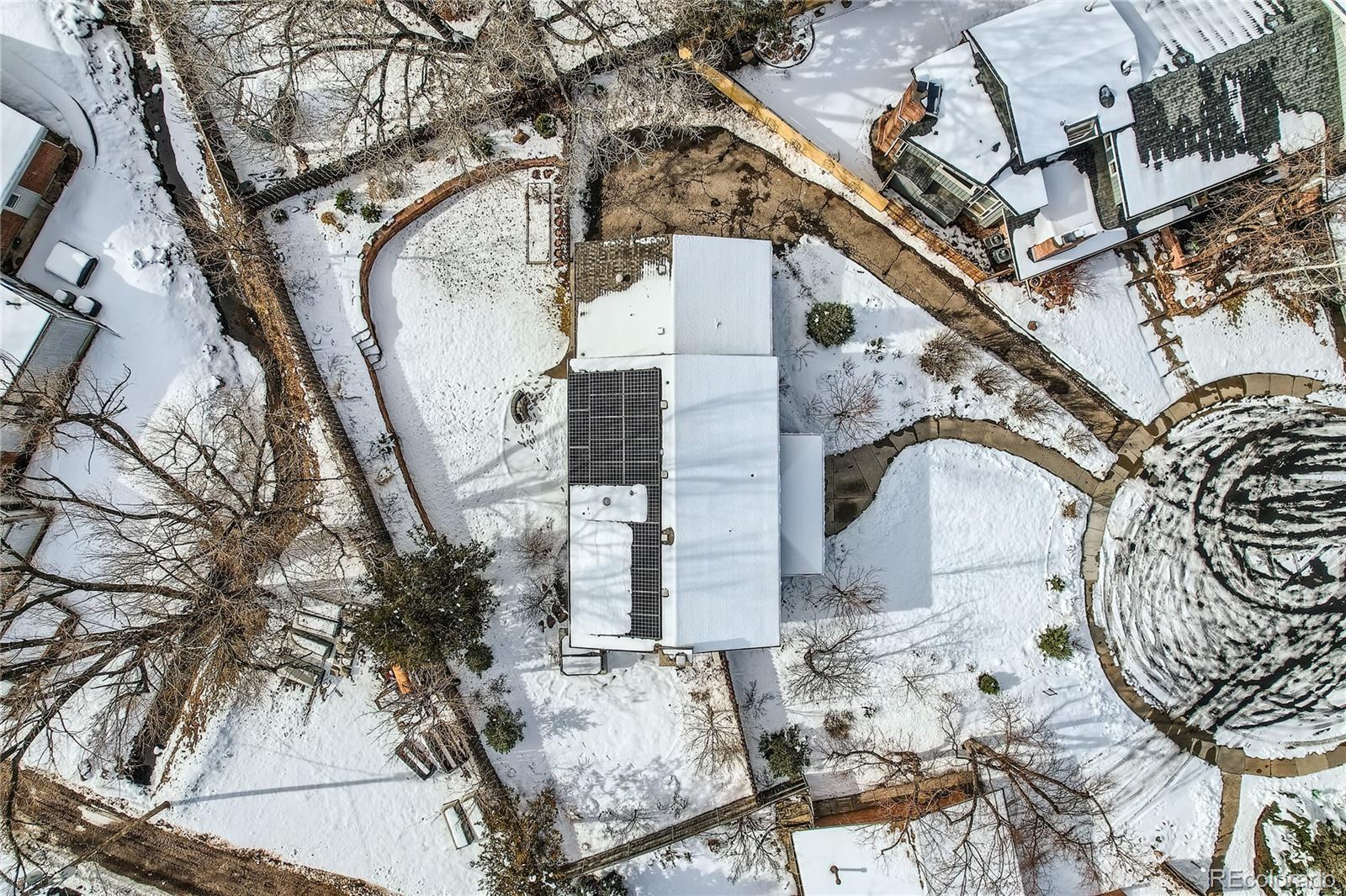 205 Fair Place Boulder, CO 80302 - Photo 41 of 46 a view of a house with a snow in the yard