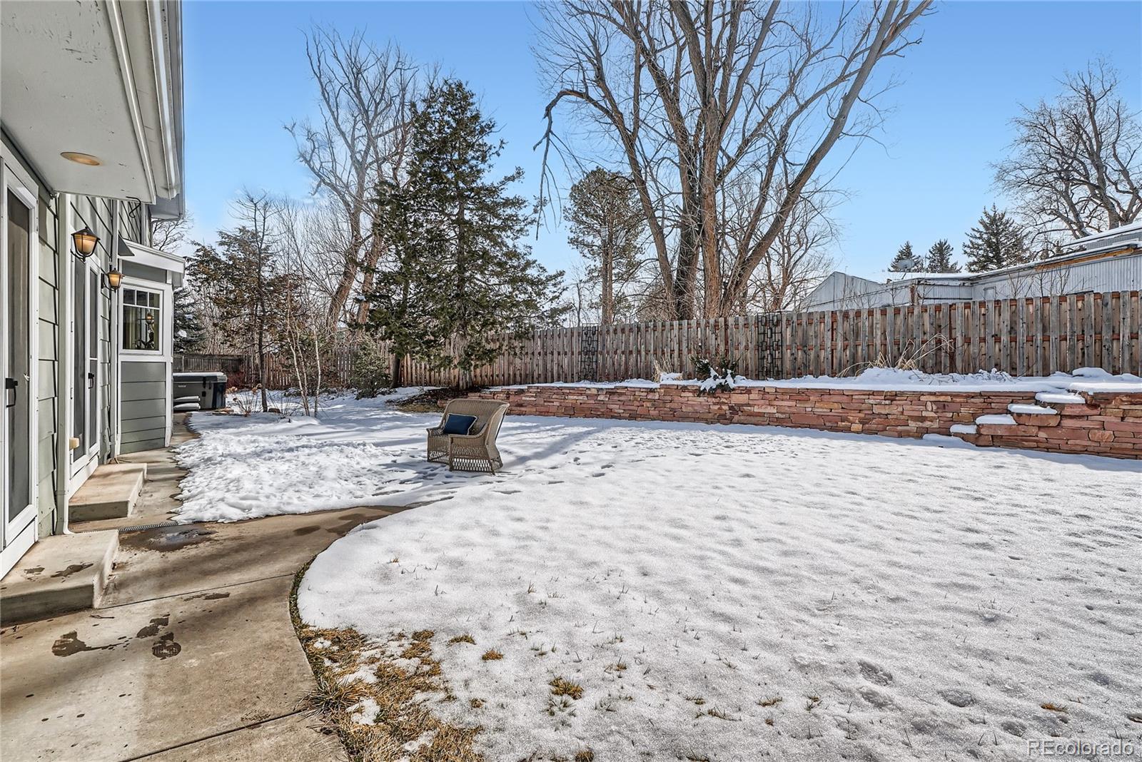 205 Fair Place Boulder, CO 80302 - Photo 44 of 46 a backyard of a house with lots of green space