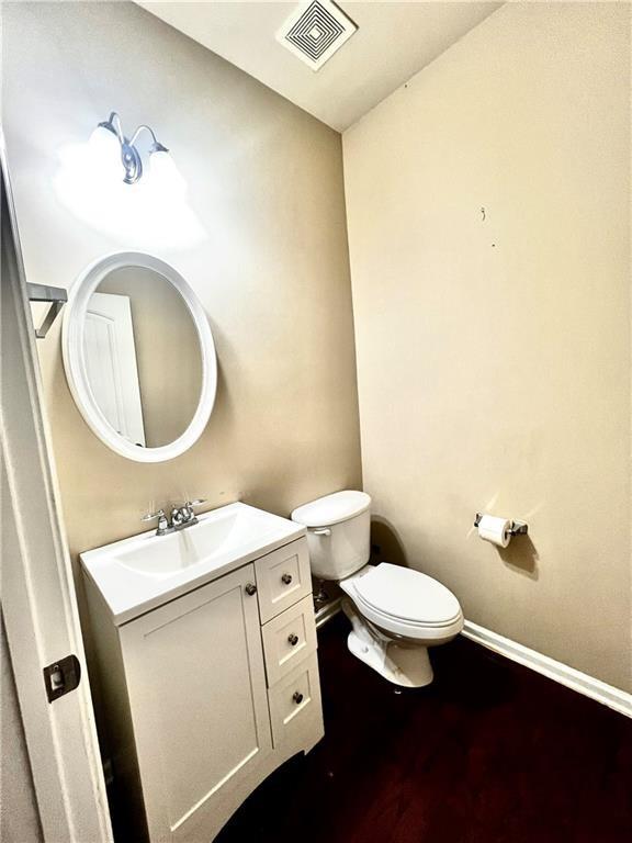 115 Tyson Woods Road Acworth, GA 30102 - Photo 11 of 23 a bathroom with a toilet sink and mirror