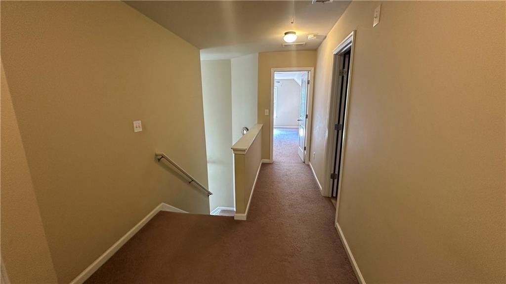 115 Tyson Woods Road Acworth, GA 30102 - Photo 13 of 23 a view of a hallway with wooden floor
