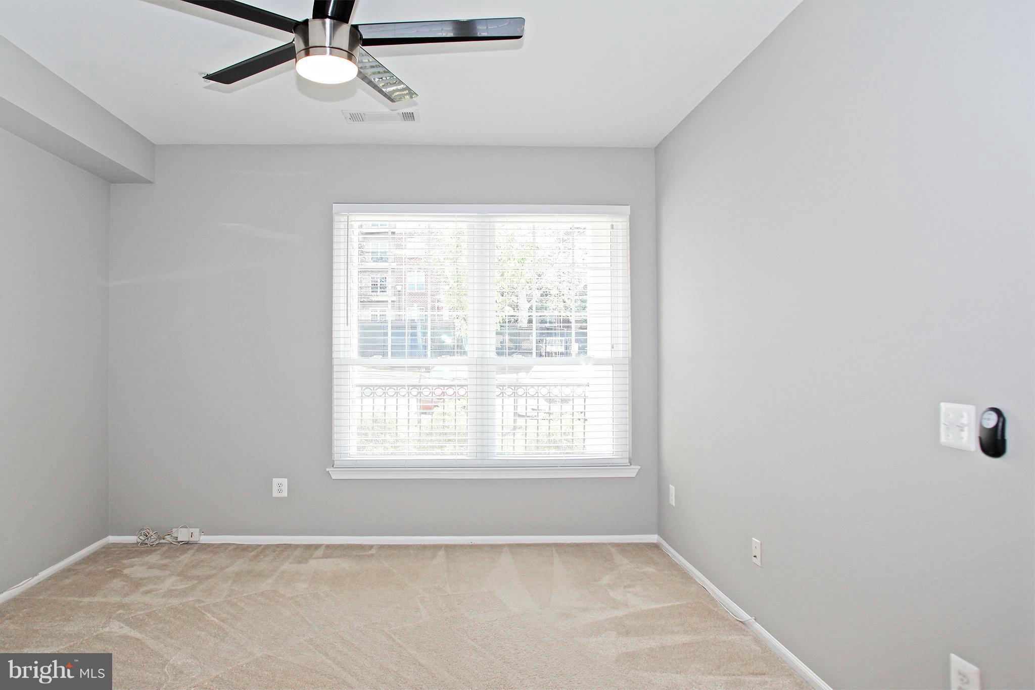 1530 Spring Gate Dr., Unit 9103 McLean, VA 22102 - Photo 11 of 30 a view of an empty room with a window