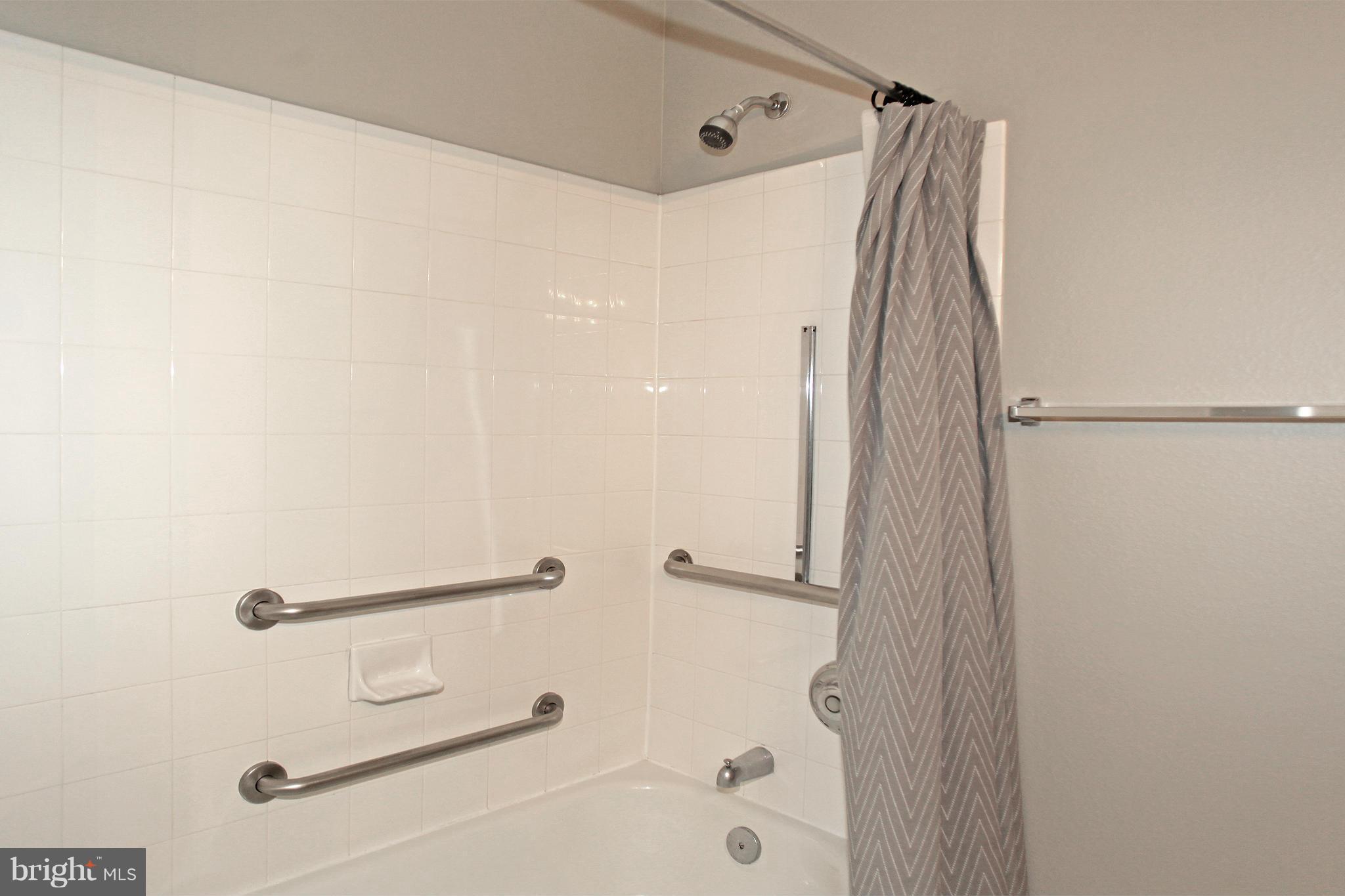 1530 Spring Gate Dr., Unit 9103 McLean, VA 22102 - Photo 15 of 30 a bathroom with a shower and a tub