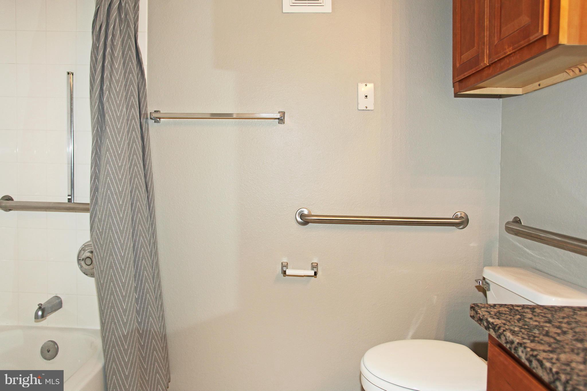 1530 Spring Gate Dr., Unit 9103 McLean, VA 22102 - Photo 16 of 30 a bathroom with a toilet and a shower