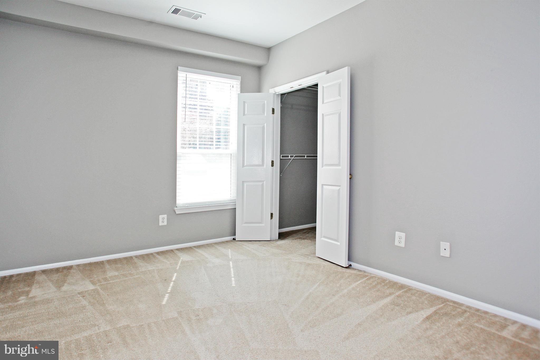 1530 Spring Gate Dr., Unit 9103 McLean, VA 22102 - Photo 20 of 30 an empty room with windows