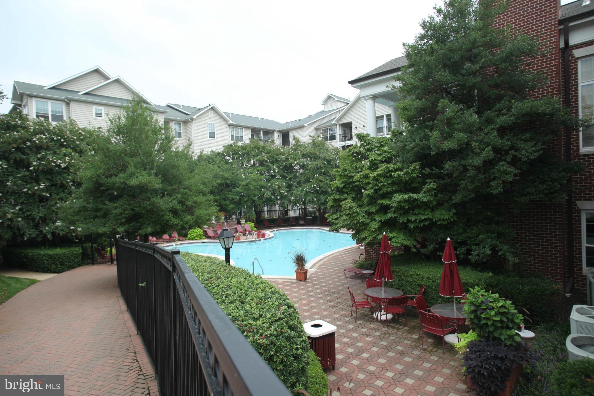 1530 Spring Gate Dr., Unit 9103 McLean, VA 22102 - Photo 21 of 30 a view of a house with backyard and garden