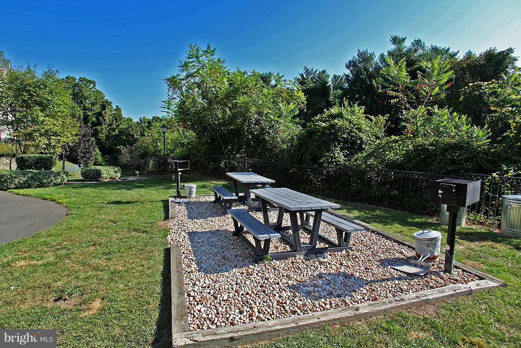 1530 Spring Gate Dr., Unit 9103 McLean, VA 22102 - Photo 26 of 30 a view of a backyard with sitting area