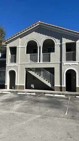a front view of a house with a garage
