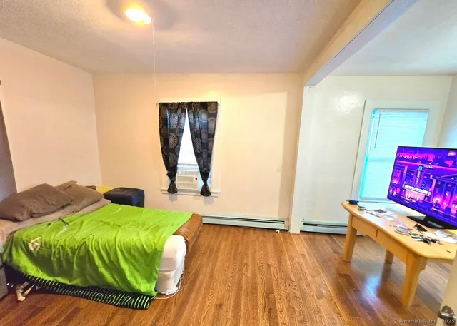 a living room with a bed and furniture