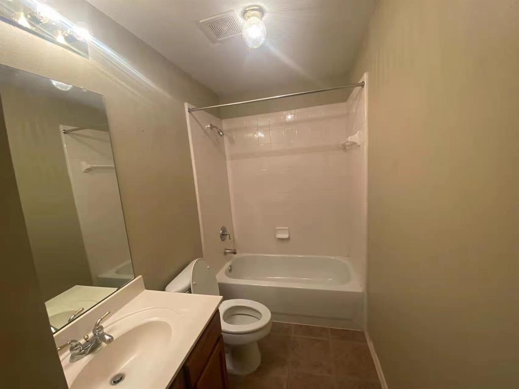 2363 Stuttgart Drive Frisco, TX 75033 - Photo 11 of 14 a bathroom with a sink a toilet and shower