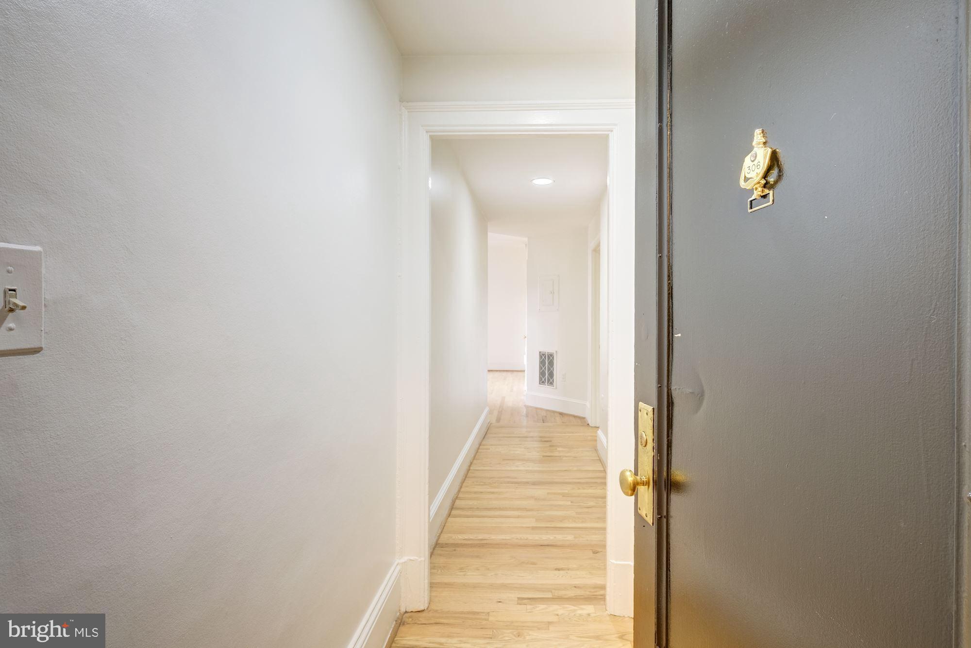 2153 California Street Northwest, Unit 306 Washington, DC 20008 - Photo 11 of 34 a view of a bedroom from the hallway