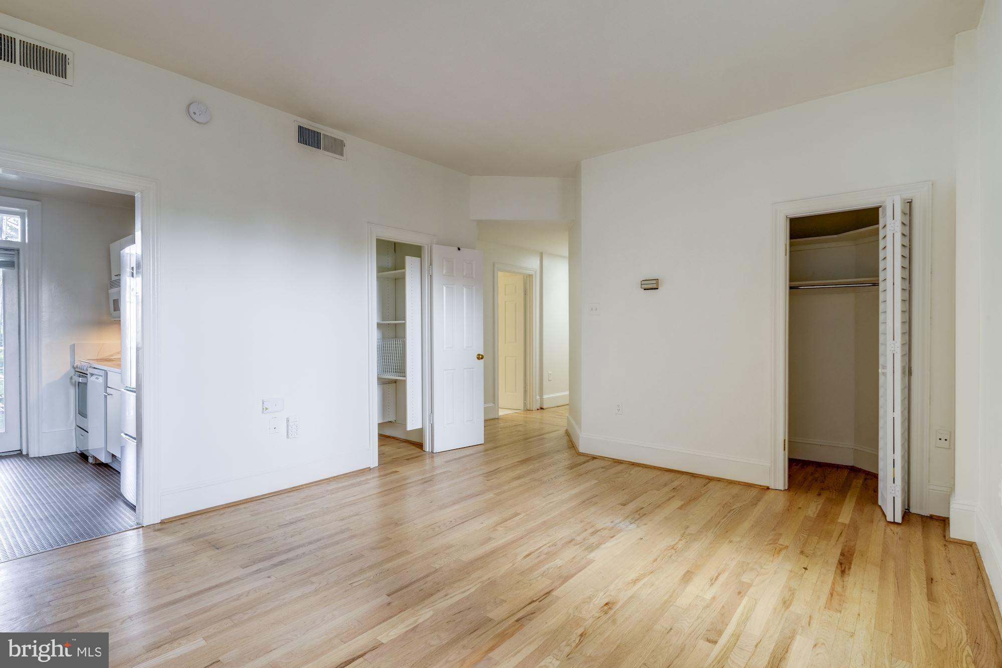 2153 California Street Northwest, Unit 306 Washington, DC 20008 - Photo 14 of 34 a view of an empty room and wooden floor