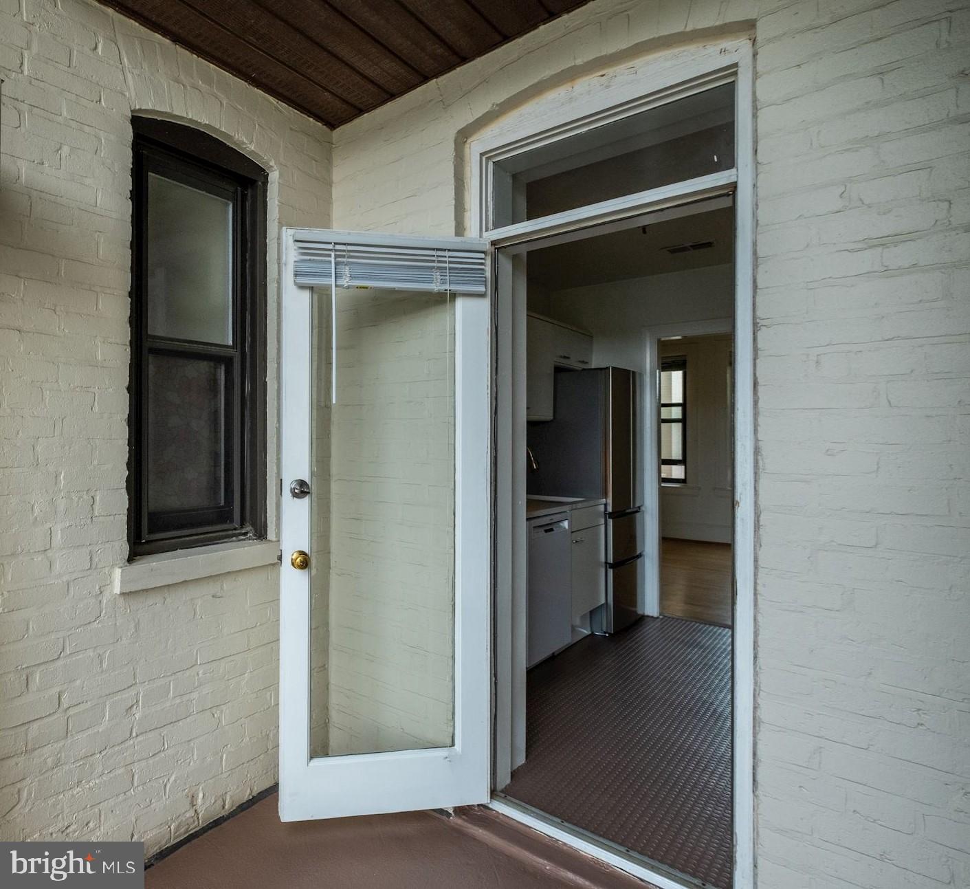 2153 California Street Northwest, Unit 306 Washington, DC 20008 - Photo 21 of 34 a view of a hallway with wooden floor and a cabinet