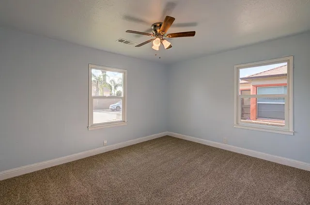 a bathroom with a sink a light fixture and a mirror