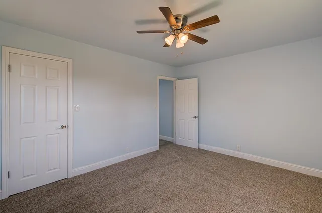 a bathroom with a sink toilet vanity and bathtub