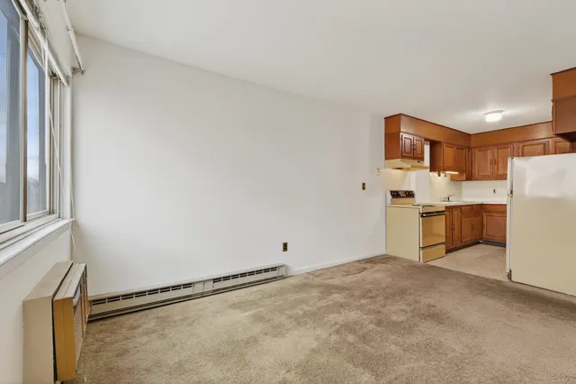 a view of a kitchen with a sink cabinets and a window