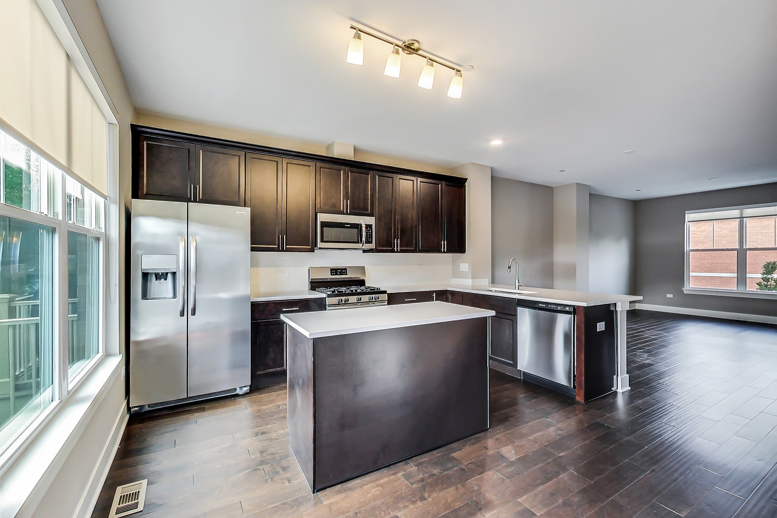25 Clay Avenue, Unit E Highwood, IL 60040 - Photo 12 of 29 a kitchen with stainless steel appliances granite countertop a refrigerator a sink a stove and oven