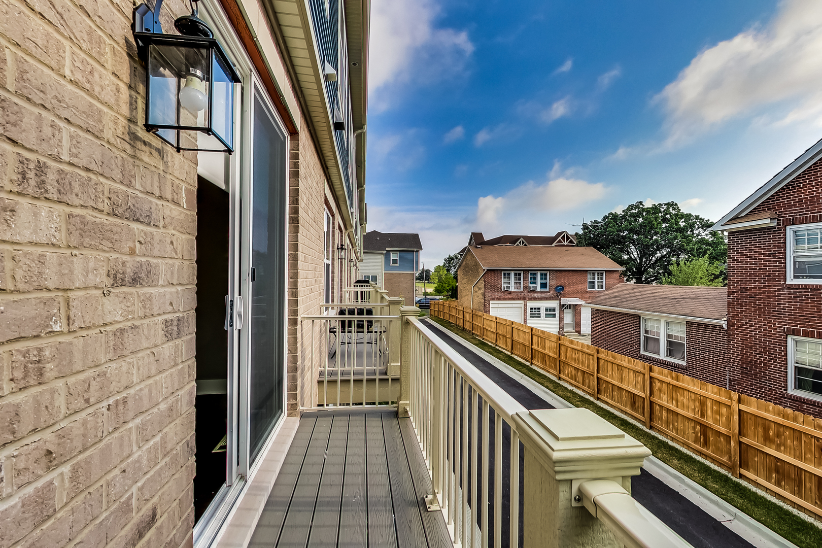 25 Clay Avenue, Unit E Highwood, IL 60040 - Photo 14 of 29 a view of a balcony with wooden floor and fence