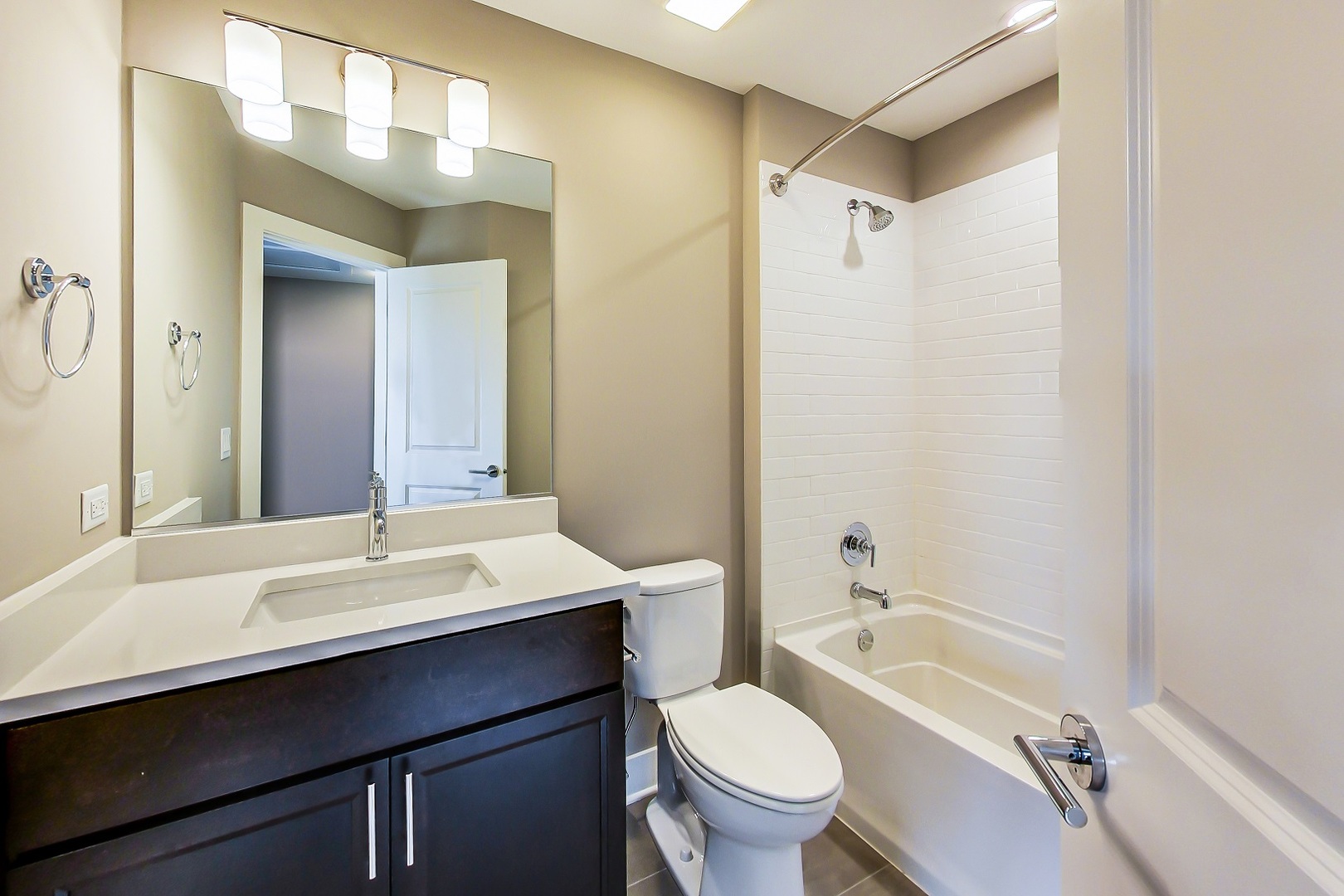 25 Clay Avenue, Unit E Highwood, IL 60040 - Photo 25 of 29 a bathroom with a sink a toilet and shower