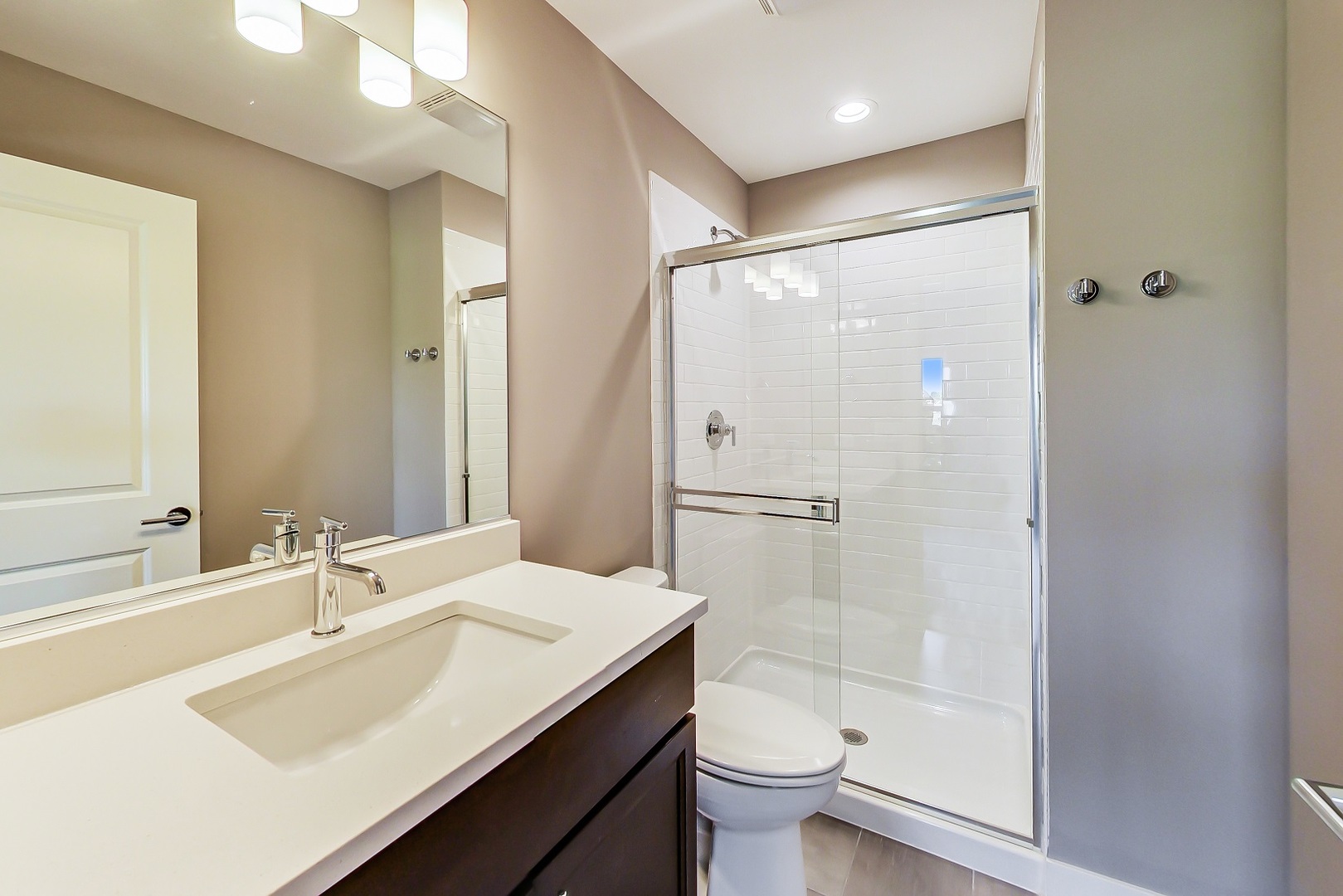 25 Clay Avenue, Unit E Highwood, IL 60040 - Photo 26 of 29 a bathroom with a bathtub shower sink mirror and toilet