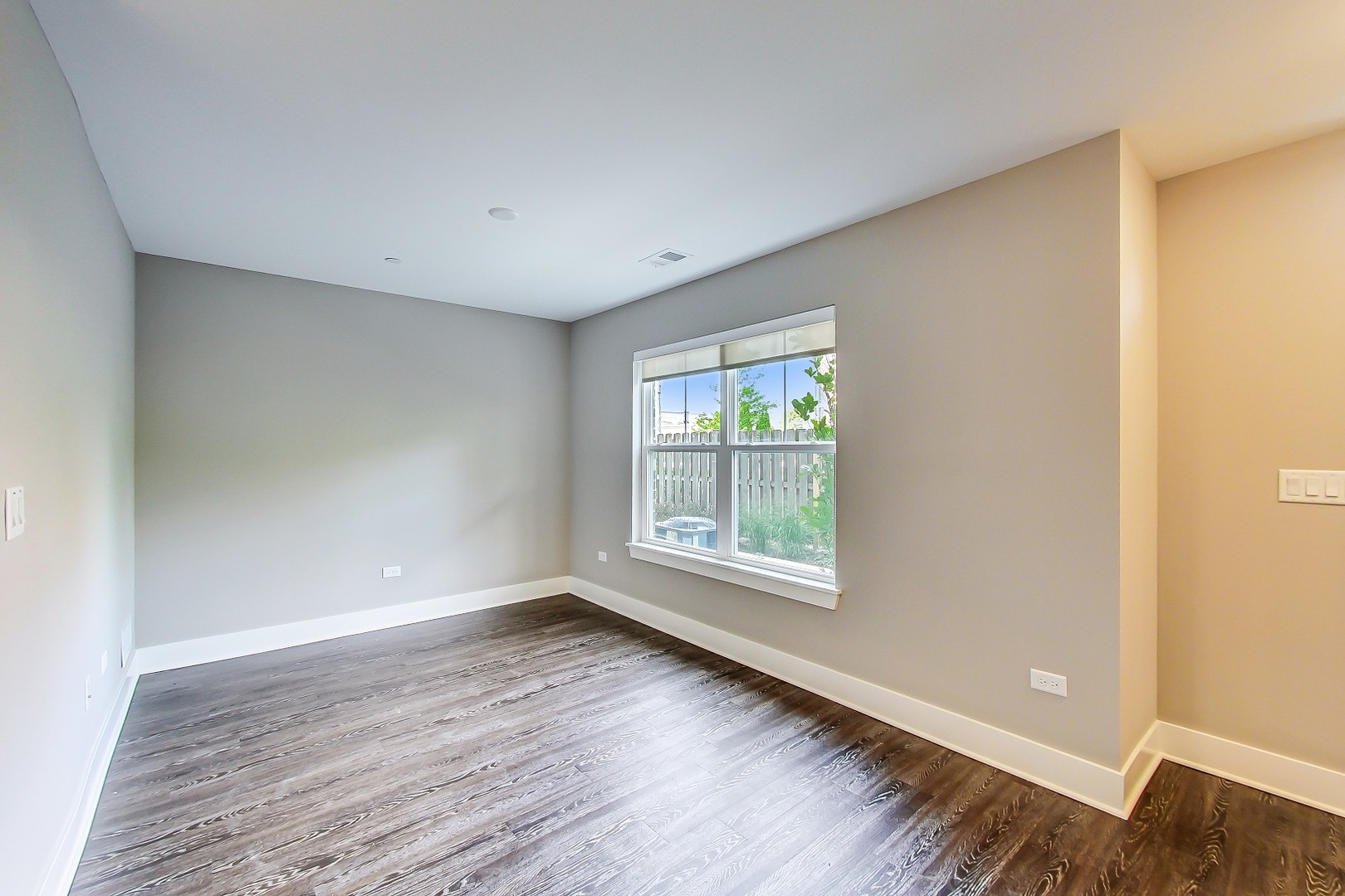 25 Clay Avenue, Unit E Highwood, IL 60040 - Photo 3 of 29 an empty room with wooden floor and windows