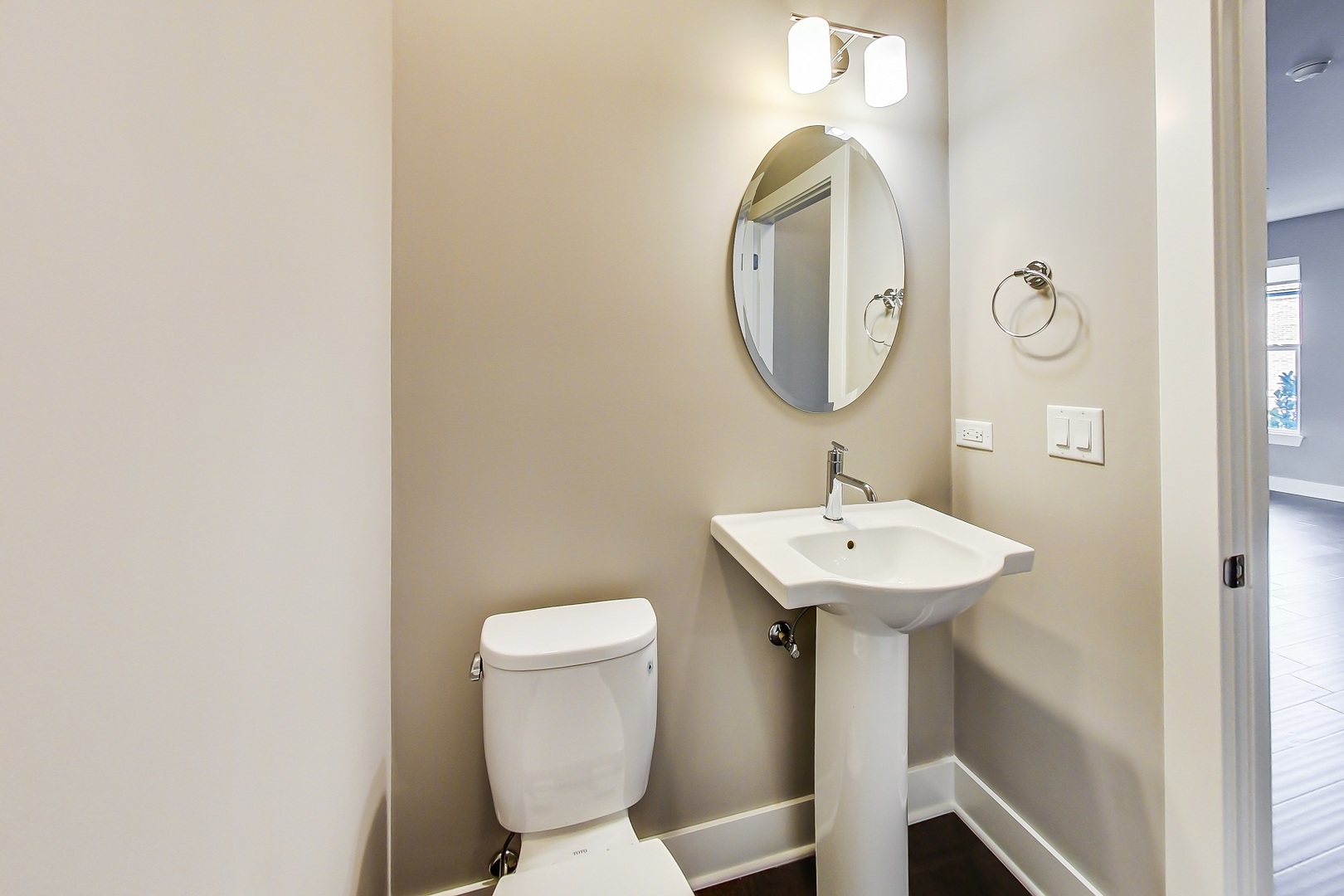 25 Clay Avenue, Unit E Highwood, IL 60040 - Photo 7 of 29 a bathroom with a toilet a sink and a mirror