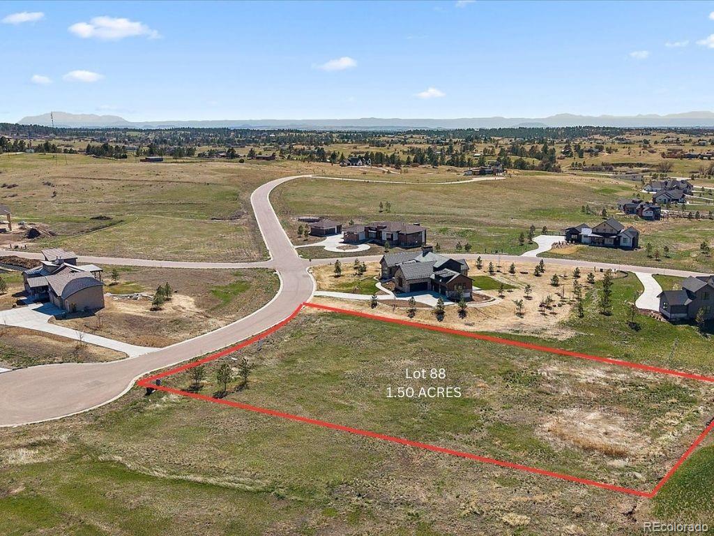 11491 Evening Hunt Road Franktown, CO 80116 - Photo 7 of 10 a view of a swimming pool and an ocean view