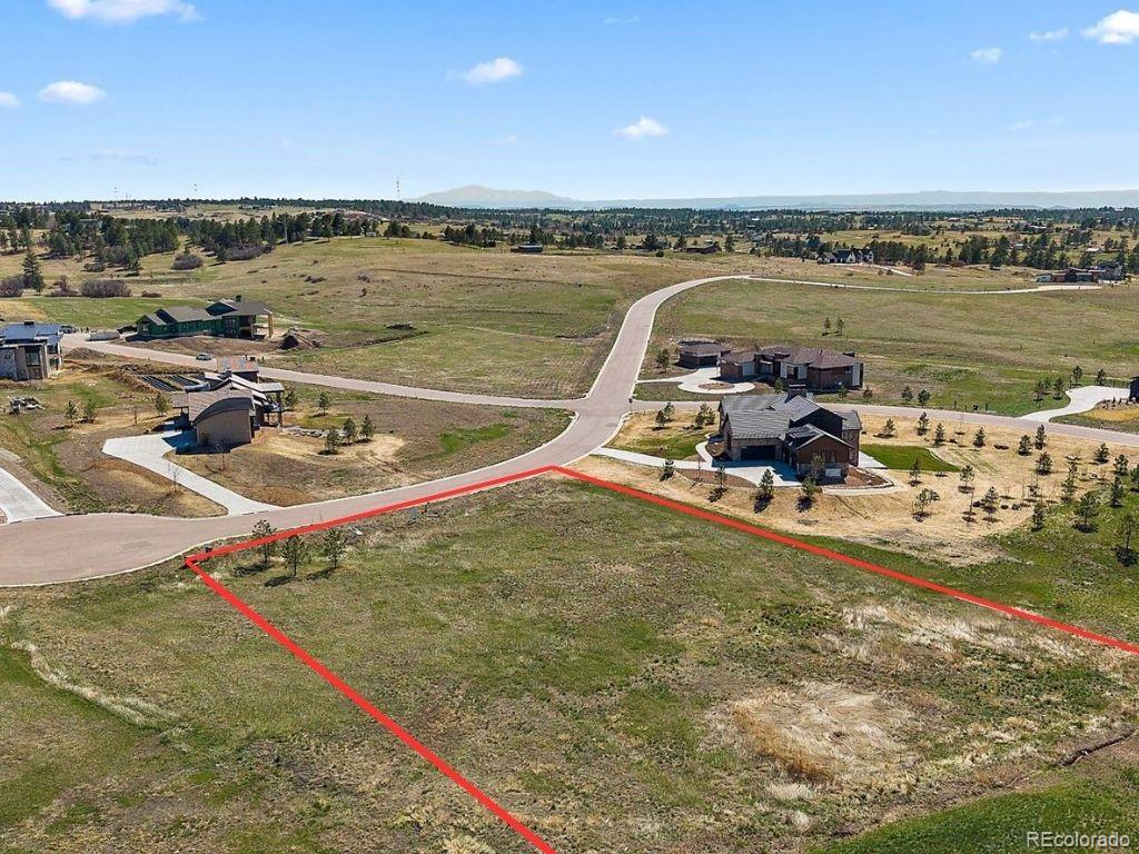 11491 Evening Hunt Road Franktown, CO 80116 - Photo 8 of 10 a view of a swimming pool and lake