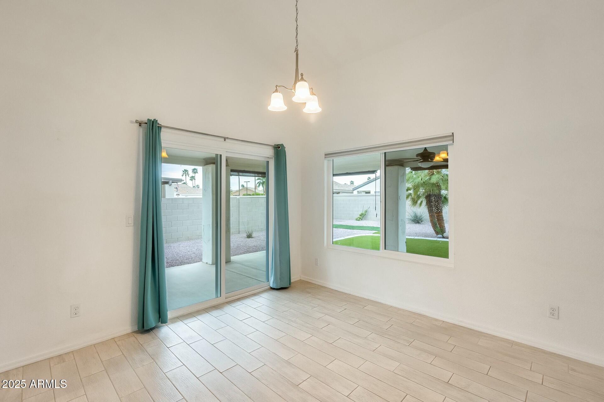 17514 North Rainbow Circle Surprise, AZ 85374 - Photo 12 of 69 a view of an empty room with a window