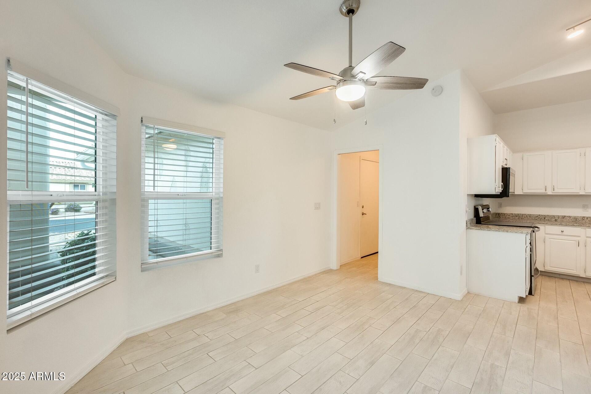 17514 North Rainbow Circle Surprise, AZ 85374 - Photo 14 of 69 a view of a kitchen with a sink and cabinet