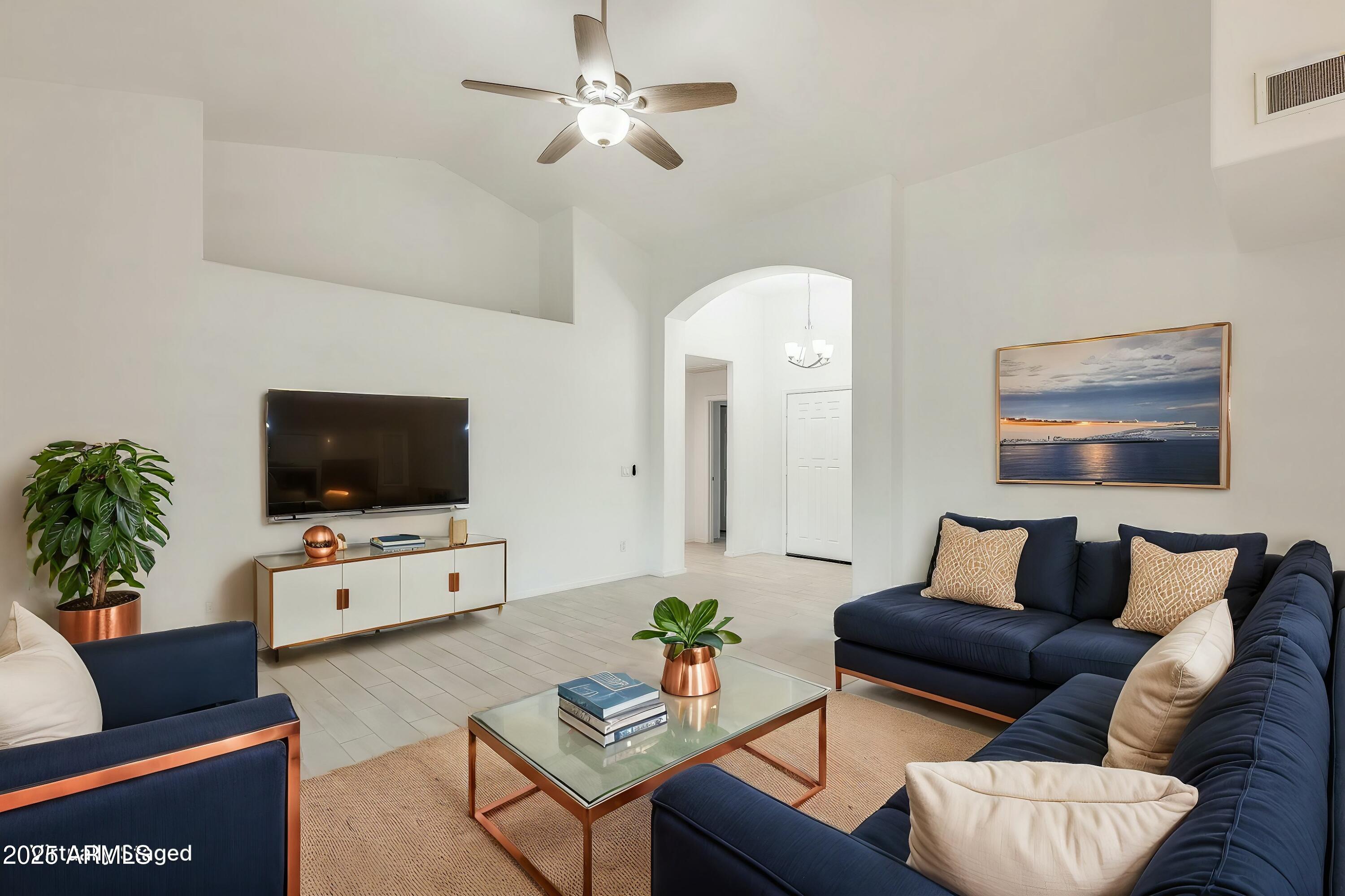 17514 North Rainbow Circle Surprise, AZ 85374 - Photo 2 of 69 a living room with furniture and a flat screen tv