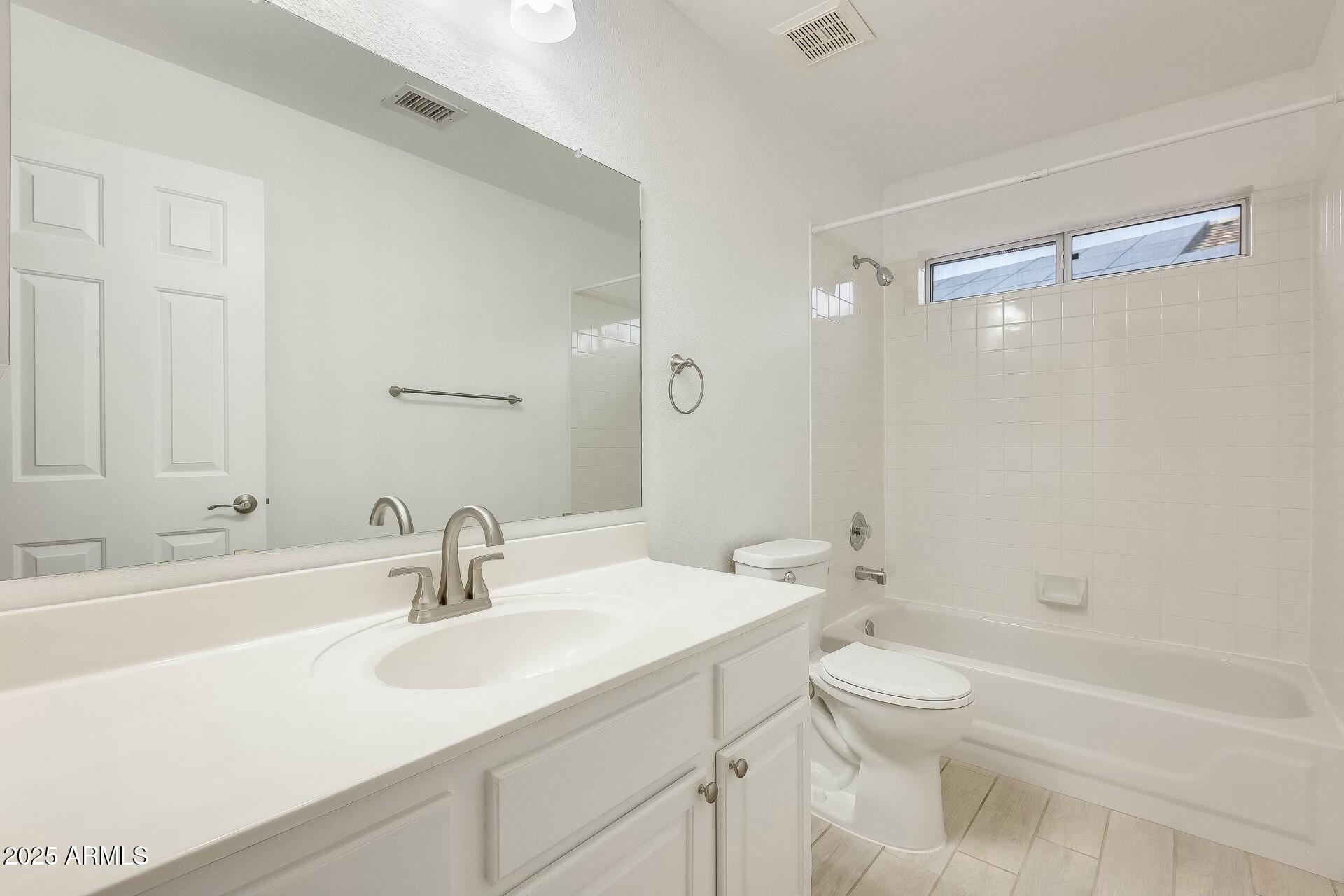 17514 North Rainbow Circle Surprise, AZ 85374 - Photo 25 of 69 a bathroom with a sink a toilet and a bathtub