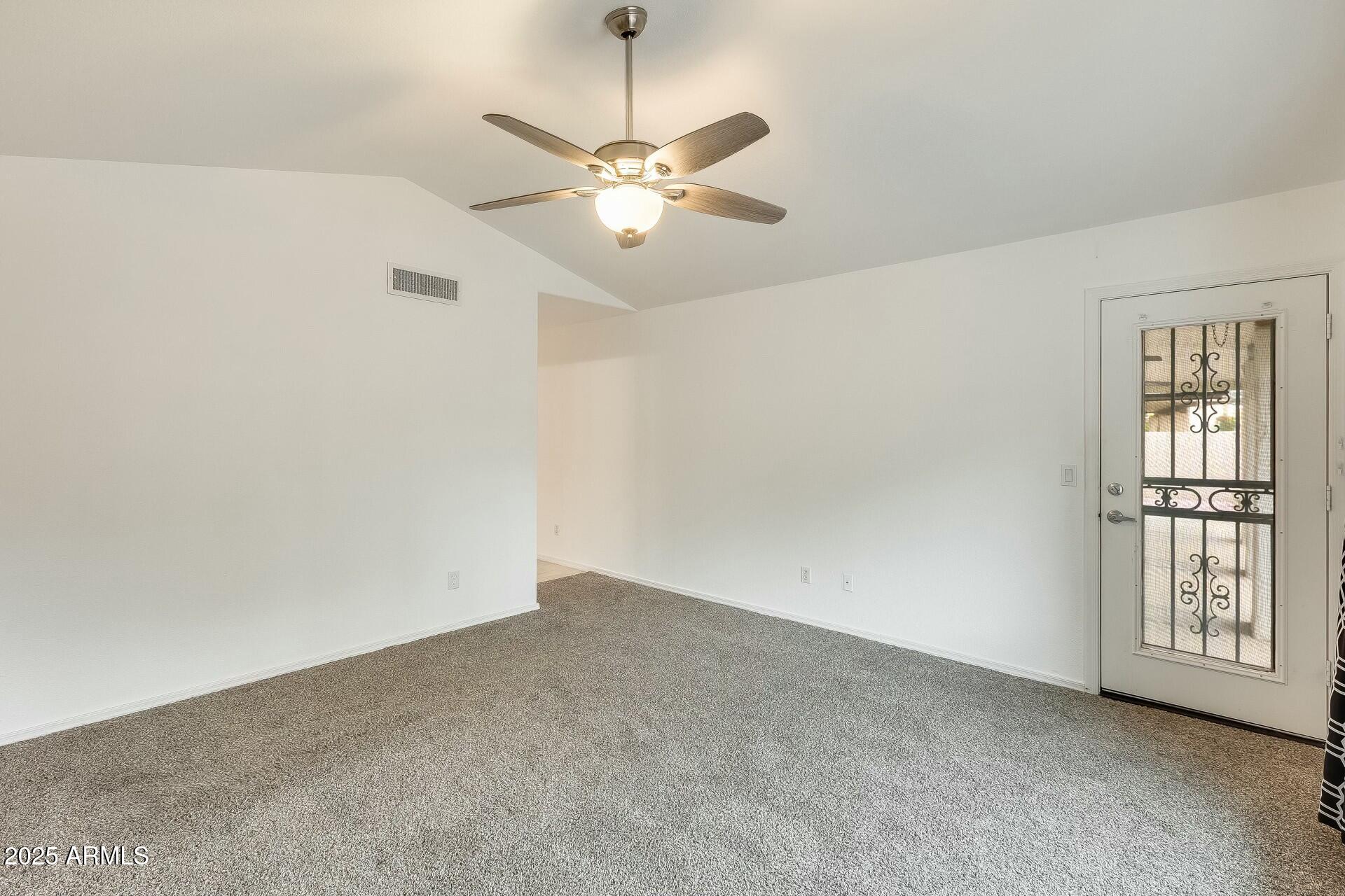 17514 North Rainbow Circle Surprise, AZ 85374 - Photo 28 of 69 a view of an empty room with a window