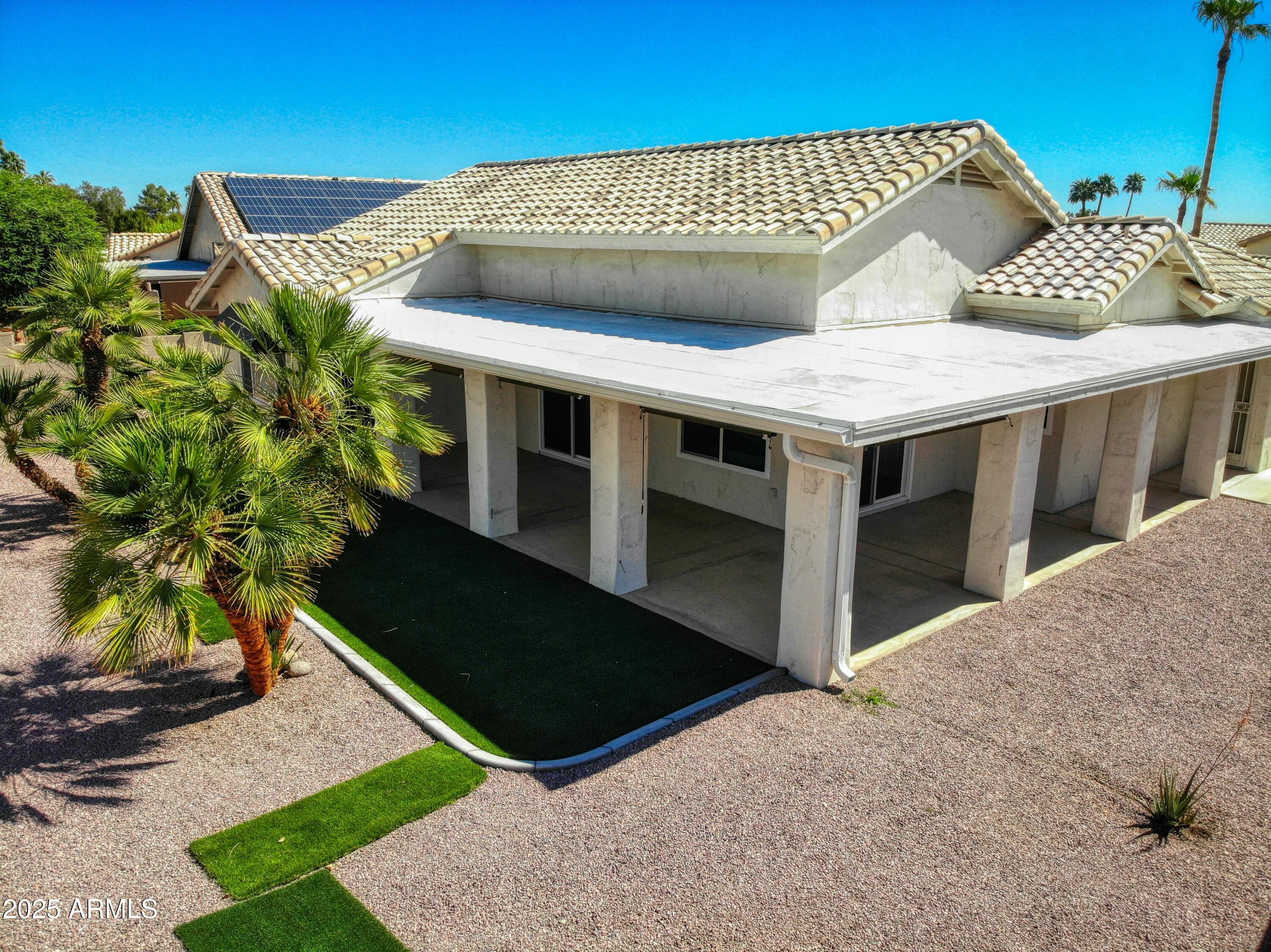 17514 North Rainbow Circle Surprise, AZ 85374 - Photo 40 of 69 a front view of a house with a yard