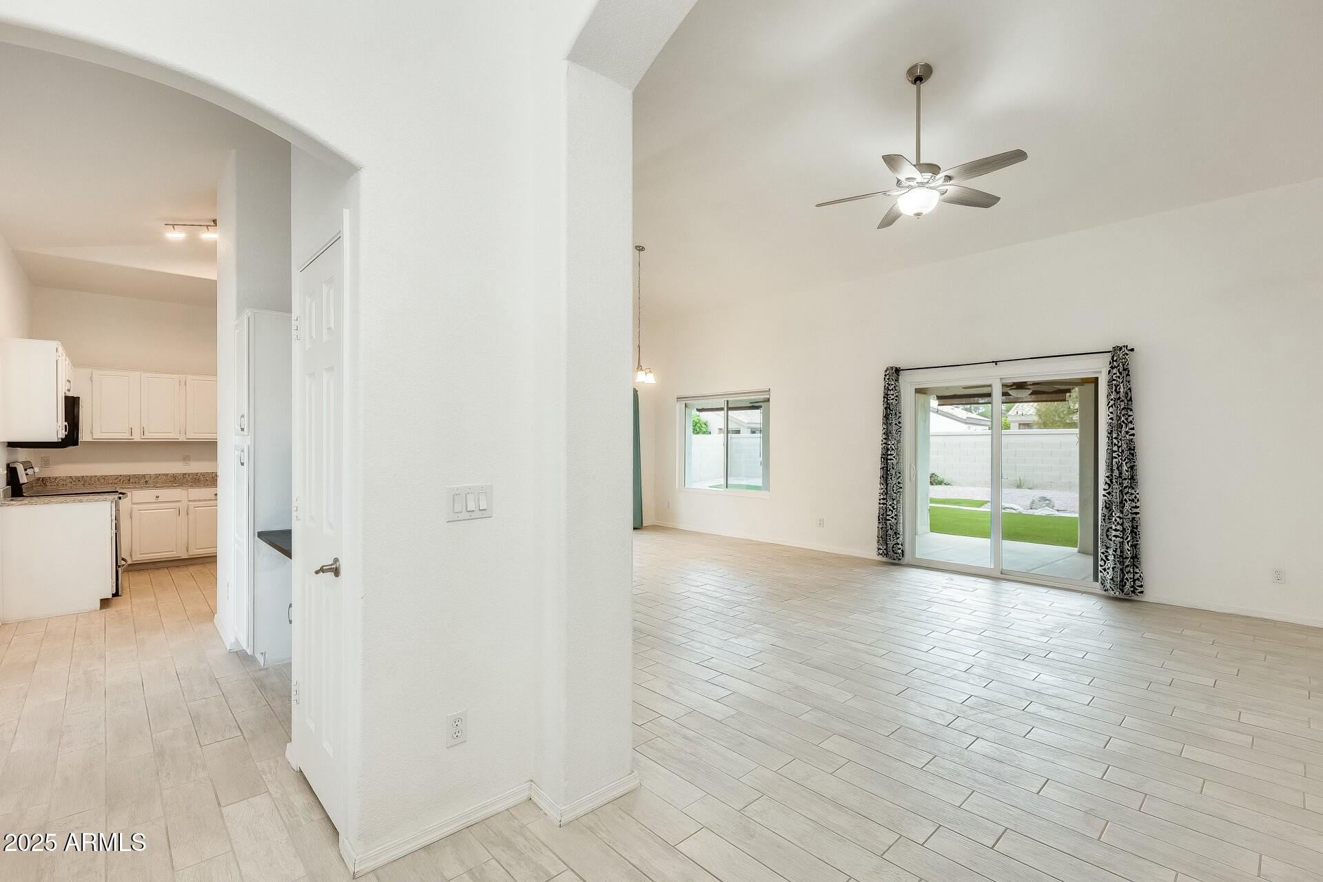 17514 North Rainbow Circle Surprise, AZ 85374 - Photo 8 of 69 a view of an empty room with a window