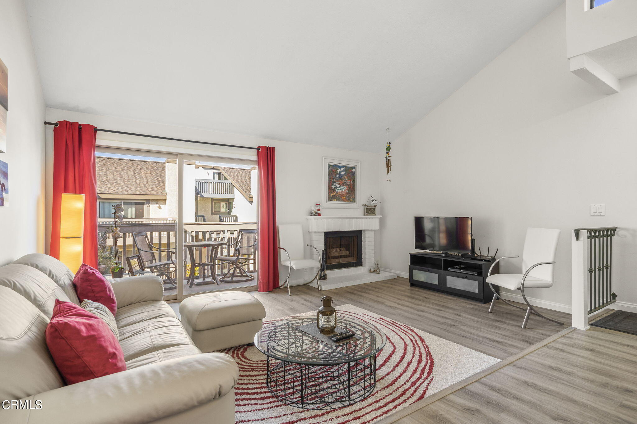 3140 Sunset Lane Oxnard, CA 93035 - Photo 12 of 45 a living room with furniture a fireplace and a flat screen tv