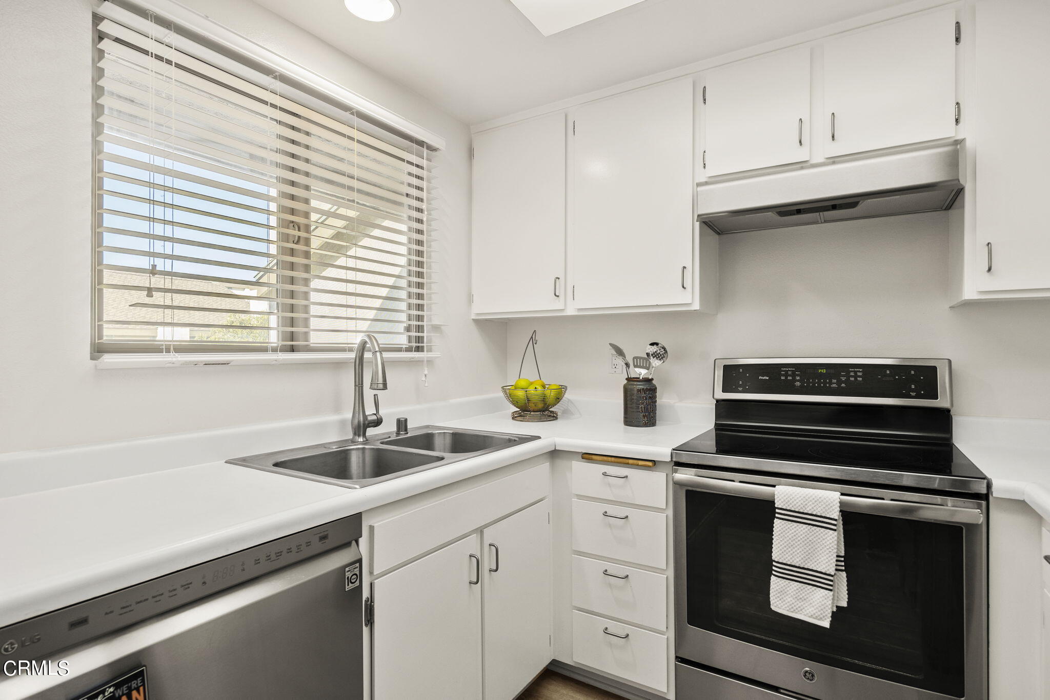 3140 Sunset Lane Oxnard, CA 93035 - Photo 15 of 45 a kitchen with appliances cabinets and a window