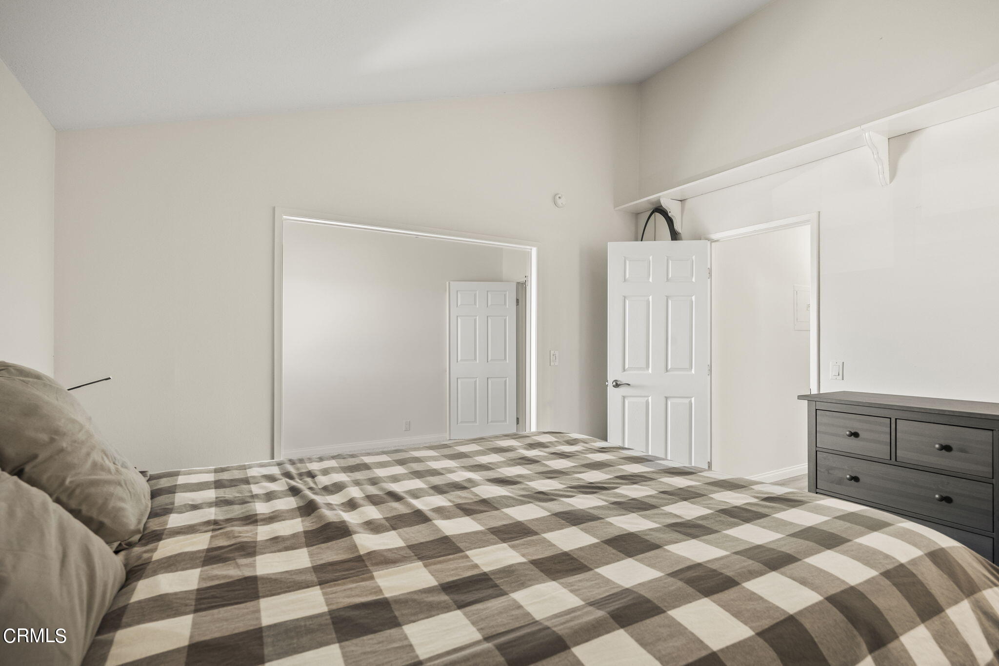 3140 Sunset Lane Oxnard, CA 93035 - Photo 23 of 45 a bedroom with a bed and a cabinet