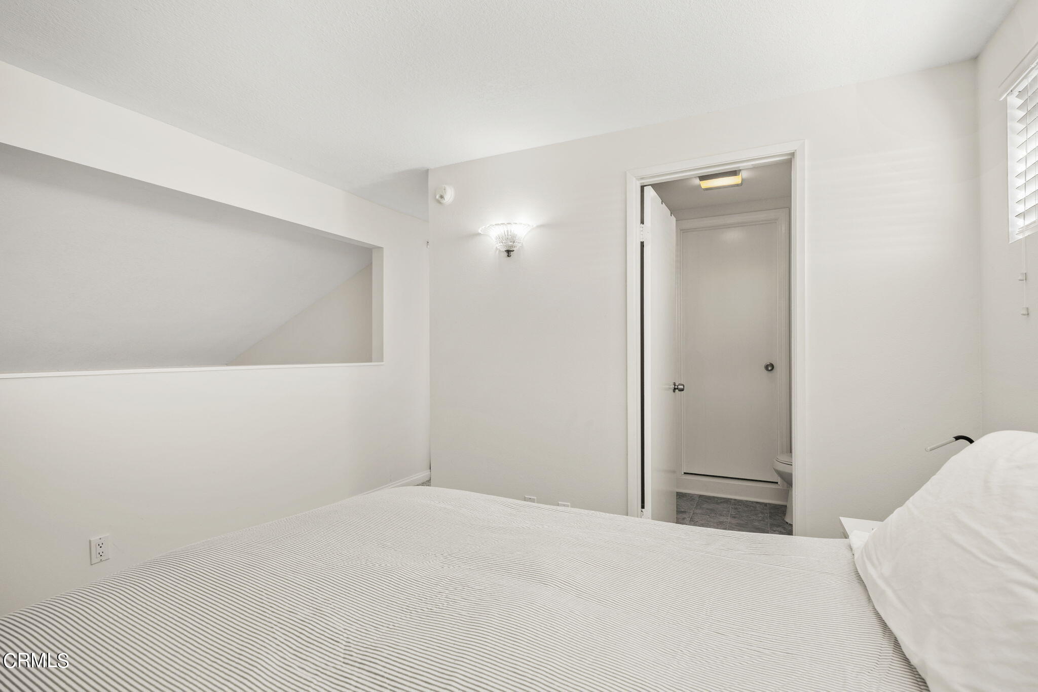 3140 Sunset Lane Oxnard, CA 93035 - Photo 28 of 45 a bedroom with a bed and a mirror