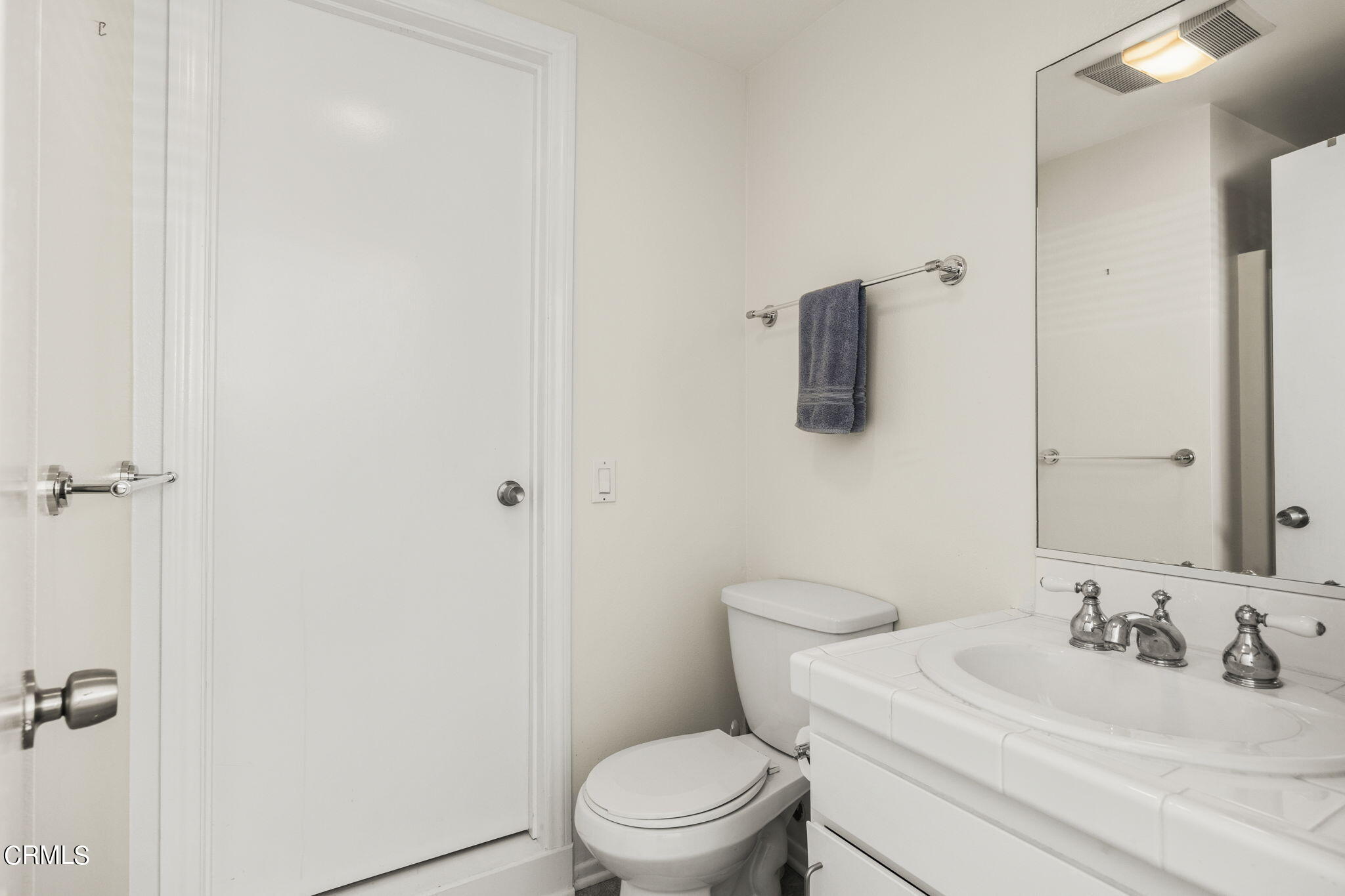 3140 Sunset Lane Oxnard, CA 93035 - Photo 29 of 45 a bathroom with a toilet sink vanity and mirror