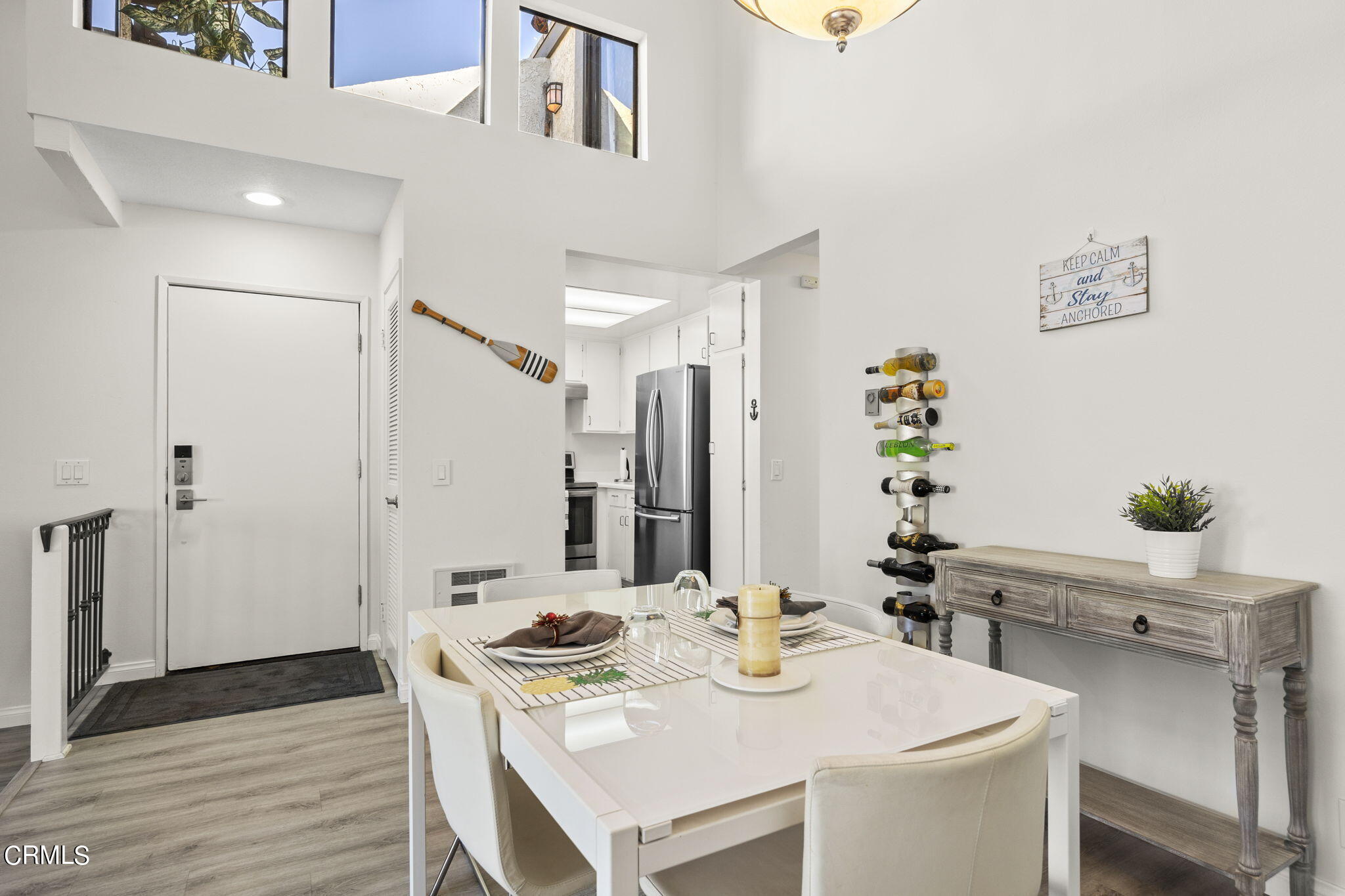 3140 Sunset Lane Oxnard, CA 93035 - Photo 6 of 45 a view of kitchen island with cabinets and wooden floor